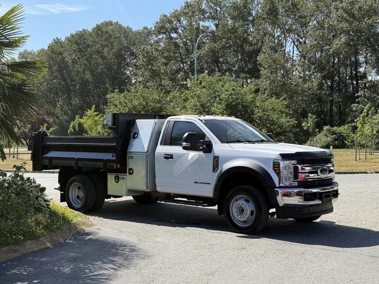 This 2019 Ford F-550 XLT dump truck is powered by a 6.7L Power Stroke V8 diesel engine paired with an automatic transmission and four-wheel drive, offering a capable platform for construction, landscaping, municipal, and commercial hauling applications. Equipped with a 9-foot by 8-foot dump body and electric-over-hydraulic dump system, this truck is designed to handle a variety of material transport and jobsite tasks.

Additional equipment includes a tarp system, trailer hitch receiver, integrated trailer brake controller, backup camera, aluminum toolbox, strobe lights, and exhaust brake. Interior and technology features include Apple CarPlay, Bluetooth connectivity, AM/FM radio, USB ports, air conditioning and heat, and power windows, power door locks, and power mirrors. Finished in white with a gray cloth interior, this F-550 XLT offers a practical combination of capability, convenience, and heavy-duty performance. This item is currently OFFSITE. You must register an appointment with our office to schedule an offsite viewing. Appointments must be made a minimum of one business day in advance (and as defined by the days that Repo.com is open for business) before your appointment can be scheduled and confirmed. We may, at our own discretion, instead opt to transport smaller items to Repo.coms main yard for viewing purposes.  $78,810.00 plus $375 processing fee, $79,185.00 total payment obligation before taxes.   Listing report, warranty, contract commitment cancellation fee, financing available on approved credit (some limitations and exceptions may apply). All above specifications and information is considered to be accurate but is not guaranteed and no opinion or advice is given as to whether this item should be purchased. We do not allow test drives due to theft, fraud, acts of vandalism and undetectable impaired driving. Instead we provide the following benefits: Complimentary Warranty (with options to extend), Limited Money Back Satisfaction Guarantee on Fully Completed Contracts, Contract Commitment Cancellation, and an Open-Ended Sell-Back Option. Ask seller for details or call 604-522-REPO(7376) to confirm listing availability.