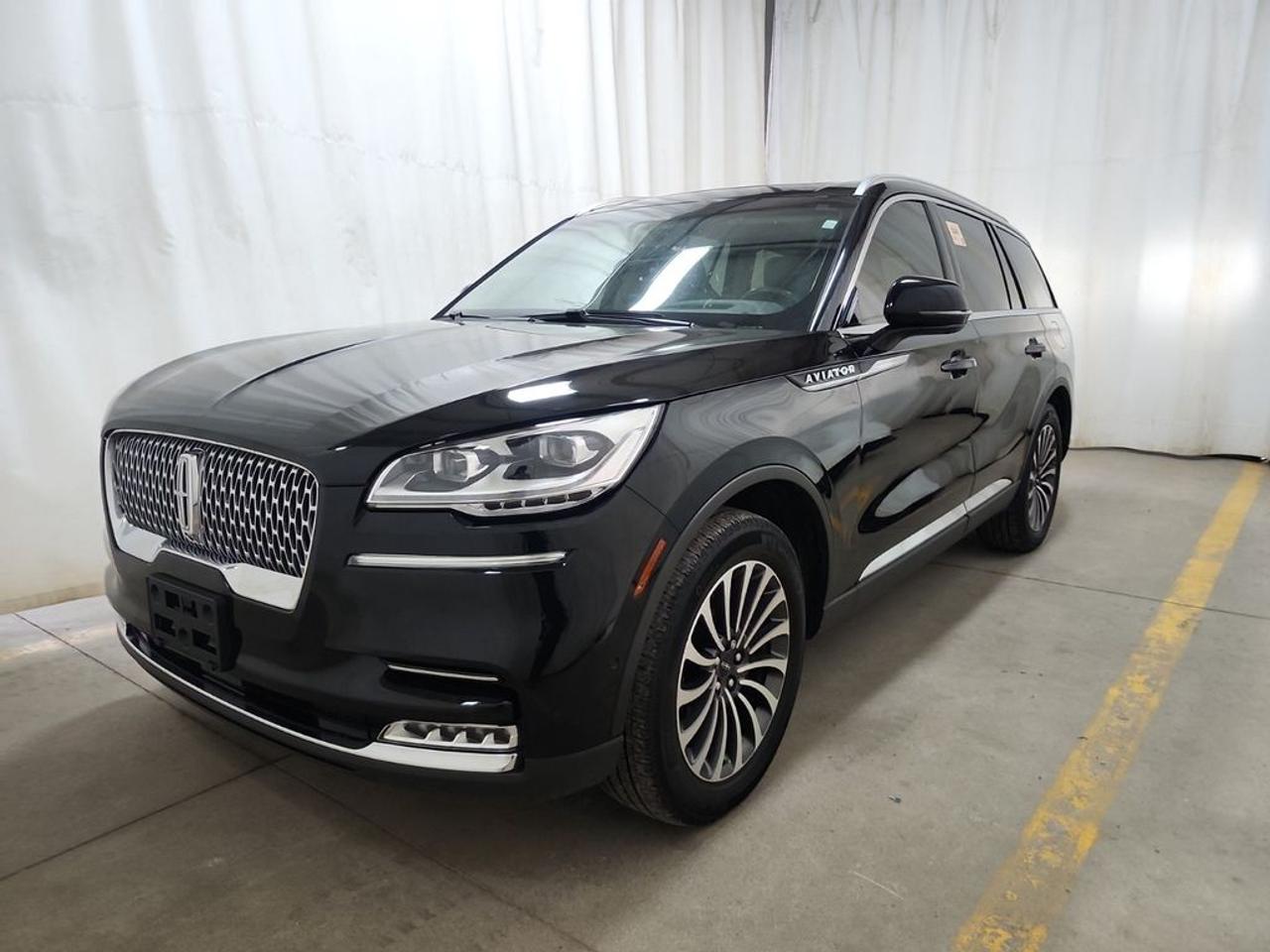 THE PRICE YOU SEE, PLUS GST. GUARANTEED!APPLE CARPLAY/ANDROID AUTO COMPATABLE! TWIN-TURBOCHARGED 3.0 LITER V6, 10 SPEED AUTO, RESERVE AWD TRIM(201a), SANDSTONE LEATHER SEATS, HEATED FRONT SEATS, HEATED REAR SEATS, HEATED STEERING WHEEL, 28 SPEAKER REVEL AUDIO, ILLUMINATION PKG, ACTIVE PARK ASSIST 2.0, CLASS IV TRAILER TOW PKG, ADAPTIVE PIXEL LED HEADLAMPS, PERFECT POSITION 30 WAY WITH ACTIVE MOTION, SYNC 3.        The 2023 Lincoln Aviator equipped with the 3.0-liter V6 engine, the 201A package, the Illumination Package, and the 28-speaker Revel Audio System offers a luxurious and technologically advanced midsize SUV that emphasizes performance, comfort, and premium sound quality. The 3.0-liter twin-turbocharged V6 engine delivers approximately 400 horsepower and 415 lb-ft of torque, providing smooth, responsive acceleration and confident highway cruising, while the all-wheel-drive system ensures optimal traction and stability across various road conditions. The 201A package typically includes a well-appointed interior featuring high-quality leather upholstery, heated and ventilated front seats, a panoramic sunroof, and a modern infotainment system with a large touchscreen, Apple CarPlay, Android Auto, and navigation. The Illumination Package enhances the cabin ambiance with ambient lighting that can be customized to suit the mood, creating a refined atmosphere during both day and night drives. The standout feature is the 28-speaker Revel Audio System, which offers an immersive listening experience with crystal-clear sound quality, rich bass, and precise audio, transforming every journey into a concert-like experience.Do you want to know more about this vehicle, CALL, CLICK OR COME ON IN!*AMVIC Licensed Dealer; CarFax and Full Mechanical Inspection Included.