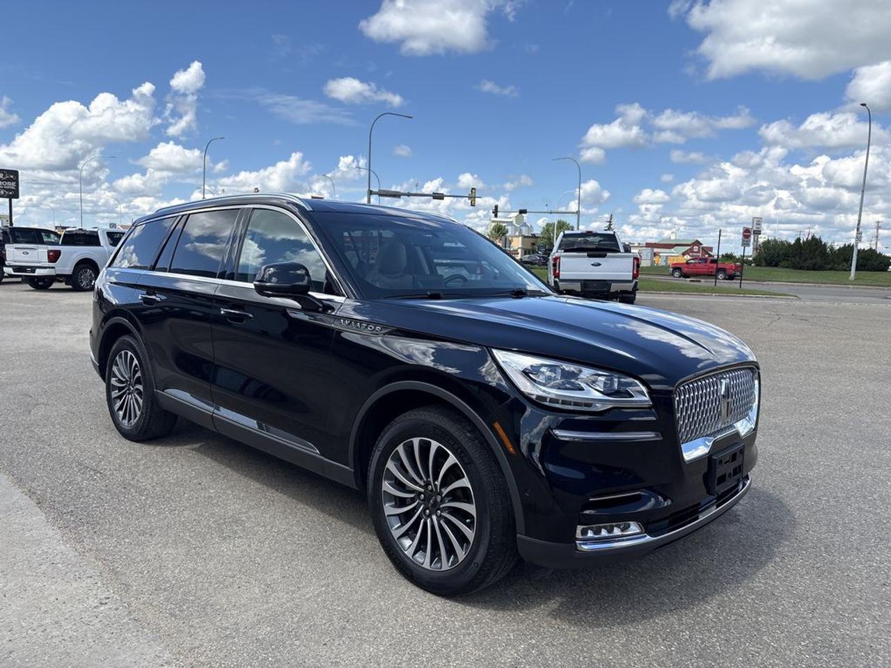 THE PRICE YOU SEE, PLUS GST. GUARANTEED!APPLE CARPLAY/ANDROID AUTO COMPATABLE! TWIN-TURBOCHARGED 3.0 LITER V6, 10 SPEED AUTO, RESERVE AWD TRIM(201a), SANDSTONE LEATHER SEATS, HEATED FRONT SEATS, HEATED REAR SEATS, HEATED STEERING WHEEL, 28 SPEAKER REVEL AUDIO, ILLUMINATION PKG, ACTIVE PARK ASSIST 2.0, CLASS IV TRAILER TOW PKG, ADAPTIVE PIXEL LED HEADLAMPS, PERFECT POSITION 30 WAY WITH ACTIVE MOTION, SYNC 3.        The 2023 Lincoln Aviator equipped with the 3.0-liter V6 engine, the 201A package, the Illumination Package, and the 28-speaker Revel Audio System offers a luxurious and technologically advanced midsize SUV that emphasizes performance, comfort, and premium sound quality. The 3.0-liter twin-turbocharged V6 engine delivers approximately 400 horsepower and 415 lb-ft of torque, providing smooth, responsive acceleration and confident highway cruising, while the all-wheel-drive system ensures optimal traction and stability across various road conditions. The 201A package typically includes a well-appointed interior featuring high-quality leather upholstery, heated and ventilated front seats, a panoramic sunroof, and a modern infotainment system with a large touchscreen, Apple CarPlay, Android Auto, and navigation. The Illumination Package enhances the cabin ambiance with ambient lighting that can be customized to suit the mood, creating a refined atmosphere during both day and night drives. The standout feature is the 28-speaker Revel Audio System, which offers an immersive listening experience with crystal-clear sound quality, rich bass, and precise audio, transforming every journey into a concert-like experience.Do you want to know more about this vehicle, CALL, CLICK OR COME ON IN!*AMVIC Licensed Dealer; CarFax and Full Mechanical Inspection Included.