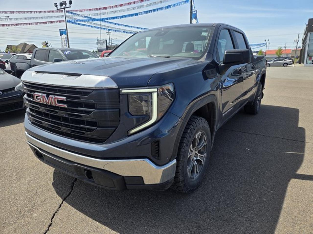 Recent Arrival!Pacific Blue Metallic 2023 GMC Sierra 1500 Pro 4WD 10-Speed Automatic EcoTec3 5.3L V810-Speed Automatic, 4WD, Jet Black Vinyl, 170 Amp Alternator, 2 Charge/Data USB Ports, 220 Amp Alternator, 4-Way Manual Driver Seat Adjuster, 4-Way Manual Passenger Seat Adjuster, 4-Wheel Disc Brakes, 6 Speakers, 6-Speaker Audio System Feature, ABS brakes, Air Conditioning, AM/FM radio, Apple CarPlay/Android Auto, Auto High-beam Headlights, Auto-Locking Rear Differential, Automatic Emergency Braking, Auxiliary External Transmission Oil Cooler, Black Manual Outside Mirrors, Brake assist, Buckle to Drive, Bumpers: chrome, Chrome Header w/Flat Black Grille Insert Bars, Convenience Package, Cruise Control, Deep-Tinted Glass, Delay-off headlights, Driver door bin, Dual front impact airbags, Dual front side impact airbags, Electric Rear-Window Defogger, Electrical Steering Column Lock, Electronic Stability Control, External Engine Oil Cooling, EZ Lift Power Lock & Release Tailgate, Following Distance Indicator, Forward Collision Alert, Front 40/20/40 Split-Bench Seat, Front anti-roll bar, Front Frame-Mounted Black Recovery Hooks, Front Pedestrian Braking, Front reading lights, Front wheel independent suspension, Fully automatic headlights, HD Rear Vision Camera, Heated Power-Adjustable Outside Mirrors, Heavy-Duty Air Filter, Hill Descent Control, Hitch Guidance, Illuminated entry, Integrated Trailer Brake Controller, IntelliBeam Automatic High Beam On/Off, Lane Keep Assist w/Lane Departure Warning, LED Cargo Area Lighting, Low tire pressure warning, Not Equipped w/Steering Column Lock, Occupant sensing airbag, Off-Road Suspension, Outside temperature display, Overhead airbag, Overhead console, Panic alarm, Passenger door bin, Passenger vanity mirror, Power Door Locks, Power Front Windows w/Driver Express Up/Down, Power Front Windows w/Passenger Express Down, Power Rear Windows w/Express Down, Power steering, Power windows, Preferred Equipment Group 1SA, Premium audio system: GMC Infotainment System, Pro Value Package, Push Button Start, Radio data system, Radio: GMC Infotainment Audio System, Rear reading lights, Rear step bumper, Remote Keyless Entry, Remote keyless entry, Solar Absorbing Tinted Glass, Speed-sensing steering, Split folding rear seat, Spray-On Pickup Bed Liner, Standard Suspension Package, Tachometer, Tilt steering wheel, Traction control, Trailering Package, Trip computer, Variably intermittent wipers, Vinyl Seat Trim, Voltmeter, Wheels: 17 x 8 Silver Painted Steel, Wheels: 18 x 8.5 6-Spoke Machined Aluminum, X31 Hard Badge, X31 Off-Road Package.At Steele GMC Buick Fredericton, were proud to be your Used Car Mega Center serving drivers all across Atlantic Canada from Fredericton, Oromocto, New Maryland, Woodstock, Saint John, and Moncton in New Brunswick, to Nova Scotia, Prince Edward Island, and Newfoundland. Our inventory features all makes and models of used cars, trucks, SUVs, and vans, giving you the best selection in the region. Whether you need a fuel-efficient sedan, a family SUV, or a rugged pickup, youll find it right here at Steele GMC Buick Fredericton. With our Market Value Pricing, every vehicle is priced based on real-time market conditions, ensuring you get the best possible deal without the hassle of negotiating. We keep pricing transparent and competitive so you can shop with total confidence. No matter your credit situation good, bad, or no credit at all youre approved. Our finance experts work with lenders across Atlantic Canada to find the best terms for your budget, including second-chance financing, newcomer programs, and credit rebuilding solutions. As part of Steele Auto Group, Atlantic Canadas most diversified automotive group with 47 dealerships representing 27 brands, we offer unmatched selection, buying power, and customer support. That means if the vehicle you want isnt on our Fredericton lot, we can source it quickly from ou