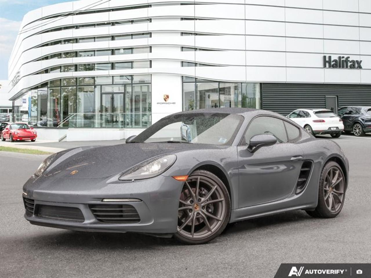 This 2025 Porsche 718 Cayman, now available at Porsche Of Halifax, is finished in Vanadium Grey Metallic with a Standard Interior in Black and is equipped with a 6-speed manual transmission.This Certified PreOwned Cayman has Unlimited Kilometer Warranty until January, 2031!PPF was installed on the following areas: All painted surfaces in the Front End, Windshield, Mirror Caps, Door Handles, Rocker Panels and lower quarter panels.Powertrain and Drivetrain2.0-litre turbocharged flat-4 engine producing 300 horsepower and 280 lb-ft of torque6-speed manual transmission with Sport Chrono PackageRear-wheel driveExteriorVanadium Grey Metallic20 Carrera S WheelsWheels painted in Satin PlatinumPower folding exterior mirrors incl. courtesy lightingClear taillightsInterior and SeatingStandard Interior in BlackPower Sport Seats (14-way) with Memory PackageVentilated SeatsHeated multifunction steering wheelGT Sport steering wheel in leatherInterior trim in Brushed AluminumPorsche Crest on headrestsElectric steering columnLuggage net in passenger footwellTechnology and Driver AssistanceBOSE® Surround Sound SystemLane Change Assist (LCA)Porsche Entry & DriveLight Design PackageSmartphone compartmentPower Steering PlusPreparation for Porsche Dashcam (Front) - Dashcam Not Included.This 718 Cayman is configured with a mid-engine rear-wheel-drive layout, a manual transmission with Sport Chrono Package, and a selection of comfort, technology, and driver assistance features.Visit www.porscheofhalifax.com or call (902)453-8800 to speak with a Porsche Sales Executive.