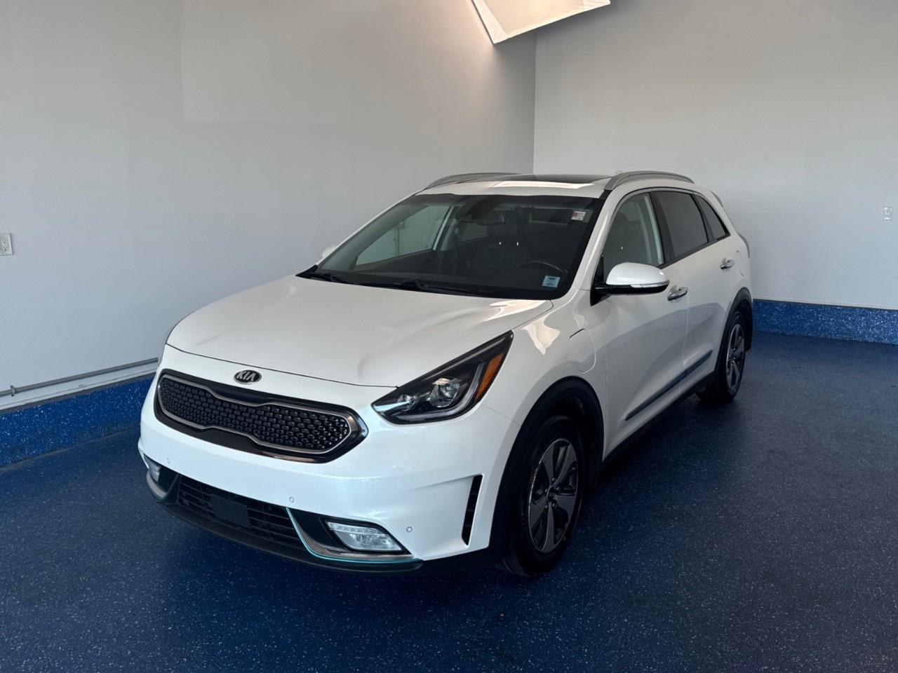 New Price! 2019 Kia Niro Plug-In Hybrid SX Premium Hybrid SX Premium | Zacks Certified. 6-Speed Dual Clutch FWD Snow White Pearl 1.6L I4 DGI Hybrid DOHC 16V LEV3-SULEV30<br /><br /><br />1.6L I4 DGI Hybrid DOHC 16V LEV3-SULEV30, ABS brakes, Alloy wheels, Electronic Stability Control, Front dual zone A/C, Heated door mirrors, Heated Front Bucket Seats, Heated front seats, Illuminated entry, Low tire pressure warning, Power moonroof, Remote keyless entry, Traction control.<br /><br />Certification Program Details: Fresh 2 Yr MVI | 30 day warranty* | 110 point inspection | Full tank of fuel | Krown rustproofed | Flexible financing options | Professionally detailed<br /><br />This vehicle is Zacks Certified! You're approved! We work with you. Together we'll find a solution that makes sense for your individual situation. Please visit us or call 902 843-3900 to learn about our great selection.<br /><br />With 22 lenders available Zack's Auto Sales can offer our customers with the lowest available interest rate. Thank you for taking the time to check out our selection!
