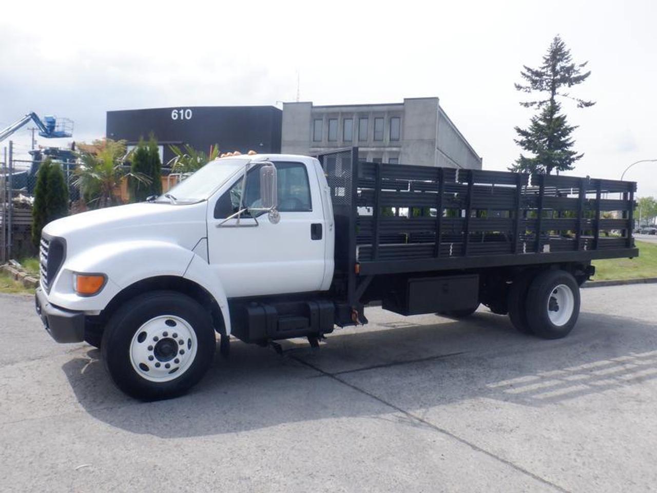 2001 Ford F-650 18 Foot Flat Deck Diesel, Air Brakes  7.2L L6 DIESEL Cat engine, 6 cylinder, 2 door, manual, 4X2, cruise control, air conditioning, AM/FM radio, white exterior, grey interior, vinyl. 8 Foot Wide. Certificate and Decal Valid until April 2023 This item is currently OFFSITE. You must register an appointment with our office to schedule an offsite viewing. Appointments must be made a minimum of one business day in advance (and as defined by the days that Repo.com is open for business) before your appointment can be scheduled and confirmed. We may, at our own discretion, instead opt to transport smaller items to Repo.coms main yard for viewing purposes.  $26,890.00 plus $375 processing fee, $27,265.00 total payment obligation before taxes.   Listing report, warranty, contract commitment cancellation fee. All above specifications and information is considered to be accurate but is not guaranteed and no opinion or advice is given as to whether this item should be purchased. We do not allow test drives due to theft, fraud, acts of vandalism and undetectable impaired driving. Instead we provide the following benefits: Complimentary Warranty (with options to extend), Limited Money Back Satisfaction Guarantee on Fully Completed Contracts, Contract Commitment Cancellation, and an Open-Ended Sell-Back Option. Ask seller for details or call 604-522-REPO(7376) to confirm listing availability.