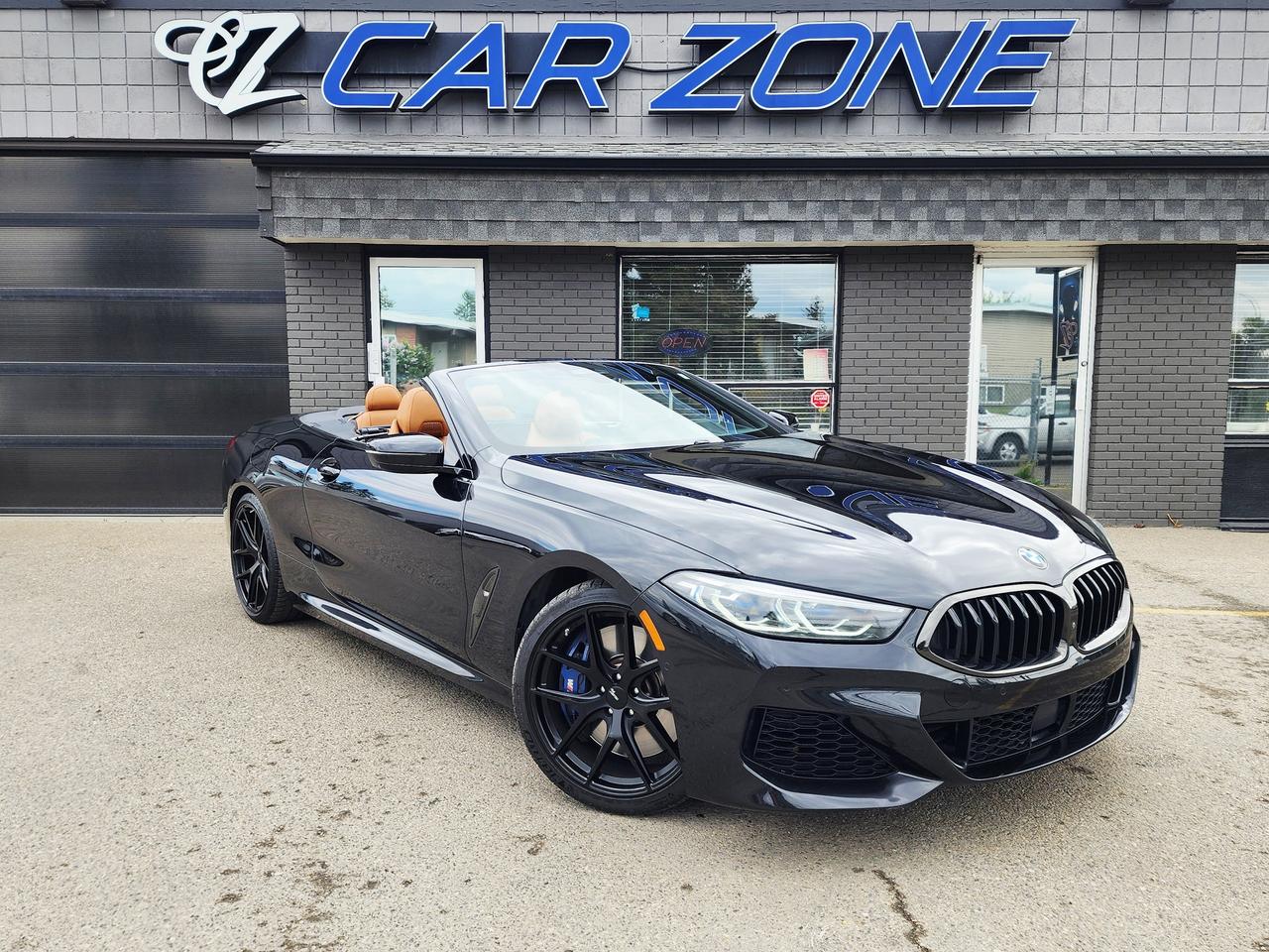 <p>Experience the pinnacle of automotive luxury and performance with this stunning pre-owned 2019 BMW M850i xDrive Cabriolet, now available at Car Zone. Dressed in a sophisticated Black exterior and complemented by a sleek Black interior, this convertible is designed to turn heads and ignite your driving passion. Under the hood lies a potent 4.4L V8 Twin Turbo engine, delivering exhilarating power and a soundtrack that is pure automotive poetry, all while its All-Wheel Drive system ensures confident handling in any Canadian condition. With just 57,481 km on the odometer, this M850i Cabriolet represents an exceptional opportunity to own a true automotive masterpiece.</p><p>This is more than just a car; its an invitation to a life of unparalleled driving pleasure. Imagine the feeling of the open road, the roar of the V8 responding to your every command, and the seamless transition through gears thanks to its advanced automatic transmission. This 2-door convertible is meticulously engineered to provide both exhilarating performance and refined comfort, making every journey an event.</p><p>Here are 5 features that make this 2019 BMW M850i xDrive Cabriolet truly exceptional:</p><ul><li><strong>4.4L V8 Twin Turbo Engine:</strong> Unleash breathtaking power and instant acceleration from this legendary V8 powerhouse, ensuring every drive is an adrenaline rush.</li><li><strong>xDrive All-Wheel Drive:</strong> Conquer any road condition with unwavering grip and dynamic handling, providing confidence and control year-round.</li><li><strong>Convertible Cabriolet Body Style:</strong> Experience the ultimate freedom and exhilaration of open-air driving, transforming your commute into an unforgettable adventure.</li><li><strong>Black Exterior & Black Interior:</strong> Command attention with a timeless and striking aesthetic, radiating sophistication and understated power.</li><li><strong>Automatic Transmission:</strong> Enjoy effortless and precise gear changes that optimize performance and contribute to a smooth, refined driving experience.</li></ul><p>Looking for Your Dream Car? Call Car Zone Today!</p><p>Thanks for viewing our Car Zone inventory. All of our vehicles come fully detailed with a Carfax and a mechanical fitness assessment. Drive this home today! Easy financing options. All credit welcome.&nbsp;<strong><a href=http://www.calgary.ca/finance>APPLY NOW</a>&nbsp;</strong>We even take trades. Same day approvals at&nbsp;<a href=http://www.carzonecalgary.ca/><strong>CARZONECALGARY</strong></a> or visit us in person at 2036 36 Street SE Calgary for a hassle free test drive. Let our friendly team of experts book an appointment with you and show you the Car Zone difference! AMVIC licensed dealer.&nbsp;</p>
