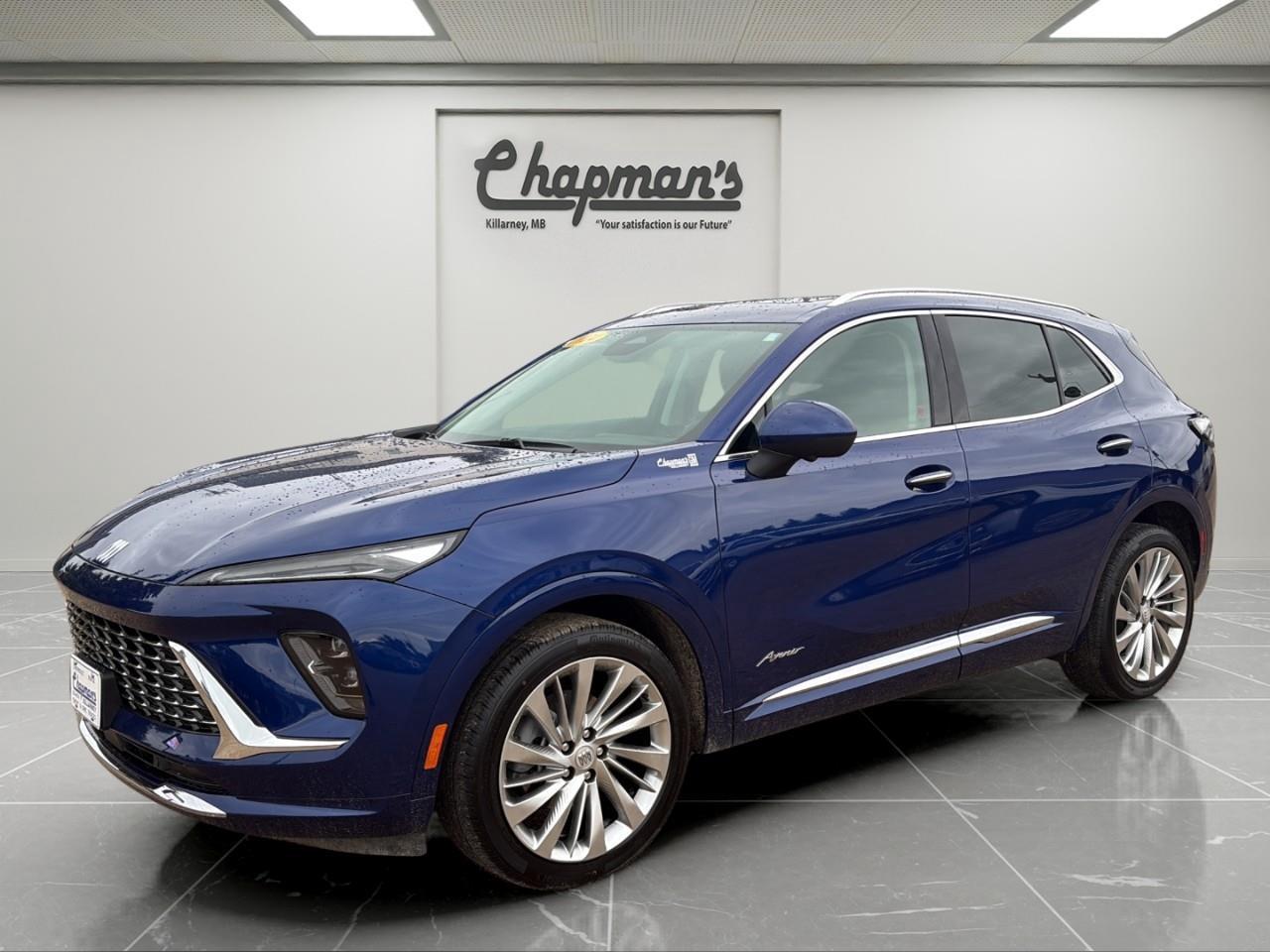 <p>Finished in stunning Calypso Blue Metallic with an Ebony interior, this 2024 Buick Envision Avenir AWD represents the pinnacle of Buick luxury, technology, and refinement. As the top-of-the-line Avenir trim, it combines premium craftsmanship, advanced safety systems, and innovative technology with confident all-wheel drive capability to create an exceptional driving experience.</p><p>Powered by a responsive 2.0L turbocharged 4-cylinder engine paired with a smooth 9-speed automatic transmission, the Envision delivers impressive performance and confident handling. With Continuous Damping Control, Active Twin-Clutch AWD, and a host of luxury amenities, every drive feels comfortable, composed, and rewarding.</p><h3>Performance & Capability</h3><p> 2.0L turbocharged 4-cylinder engine  9-speed automatic transmission  Active Twin-Clutch All-Wheel Drive  Continuous Damping Control suspension  Hill Descent Control  Electronic Grade Braking  Engine Stop/Start technology  Engine block heater  Trailering provisions  20" Pearl Nickel finish aluminum wheels  StabiliTrak stability and traction control</p><h3>Interior Comfort & Convenience</h3><p> Premium leather-appointed seating  Heated and ventilated front seats  Heated rear outboard seats  Heated steering wheel  Driver massage seat  8-way power driver seat with memory settings  8-way power passenger seat  4-way power lumbar support for front seats  Panoramic moonroof  Dual-zone automatic climate control  Wireless phone charging  Ambient interior lighting  Rear camera mirror  Universal Home Remote  Hands-free programmable power liftgate with logo projection</p><h3>Technology & Connectivity</h3><p> Ultra-wide 30" diagonal display screen  Wireless Apple CarPlay & Android Auto  Bose 9-speaker premium audio system  Wireless phone projection  OnStar and Wi-Fi hotspot capability  SiriusXM Satellite Radio  Head-Up Display  HD Surround Vision  USB connectivity ports  Remote vehicle start  Keyless open and push-button start</p><h3>Safety & Driver Assistance</h3><p> Adaptive Cruise Control  Enhanced Automatic Emergency Braking  Forward Collision Alert  Intersection Automatic Emergency Braking  Blind Zone Steering Assist  Lane Keep Assist with Lane Departure Warning  Rear Cross Traffic Braking  Rear Pedestrian Alert  Reverse Automatic Braking  Front Pedestrian and Bicyclist Braking  Side Bicyclist Alert  Following Distance Indicator  Safety Alert Seat  Traffic Sign Recognition  Speed Limit Assist  Rear Park Assist  Teen Driver technology</p><h3>Exterior Highlights</h3><p> Calypso Blue Metallic exterior  Avenir-exclusive styling  Enhanced LED headlamps  LED daytime running lamps  Hands-free power liftgate with logo projection  Panoramic moonroof  Silver roof rack cross rails  Heated power mirrors with memory settings  Deep-tinted rear glass  Rear intermittent wiper</p><p>The 2024 Buick Envision Avenir AWD delivers premium luxury, advanced technology, and confident all-weather capability in a sophisticated SUV designed for drivers who expect more from every journey.</p><p>5 Year/100,000 kilometer* Powertrain Component Warranty Coverage</p><p>5 Year/100,000 kilometer* Courtesy Transportation and 24/7 Roadside Assistance</p><p>6 Year/160,000 kilometer* Sheet Metal (Rust Through) Perforation Warranty Coverage</p><p>*Whichever Comes First.</p><p>Price Includes Dealer Fee.</p><p>Price Excludes PST & GST.</p><p>Financing Options Available, Call For More Details.</p> <p><strong>*While every reasonable effort is made to ensure the accuracy of this information, we are not responsible for any error or omissions contained on these pages. Please verify any information in question with Chapman Motors Ltd.</strong></p>