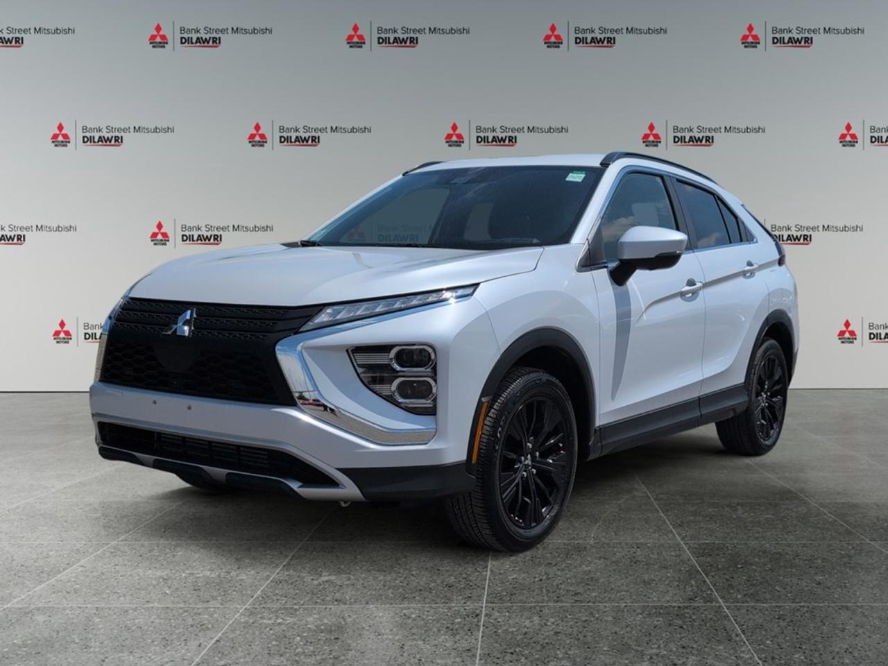 Balance of 5 year/100,000kms BASIC warranty and 10 year/160,000kms Factory Powertrain Warranty on ALL MITSUBISHI products! Best in the industry!!!! Introducing the 2022 Mitsubishi Eclipse Cross SEL S-AWC, a sophisticated white SUV designed to conquer any terrain with its robust 4x4 drivetrain. Perfect for those who demand both style and practicality, this vehicle is engineered to offer exceptional handling and comfort. The Eclipse Cross sports sleek alloy wheels that complement its contemporary exterior design. Step inside, and youll be greeted by an interior thats as stylish as it is functional, with premium features like heated seats and keyless entry enhancing every journey. Spacious and thoughtfully designed, its perfect whether youre navigating city streets or venturing off the beaten path. Stay connected and safe with advanced technology features including a Bluetooth connection and smart device integration, ensuring youre always in control, even on the go. A backup camera, cruise control, and brake assist add to the vehicles safety features, providing peace of mind for you and your passengers. This 2022 Mitsubishi Eclipse Cross is ideally suited for adventurous families or individuals with a taste for both comfort and capability. Dont miss out on this fantastic vehicle. Contact Bank Street Mitsubishi today to learn more and arrange a test drive.