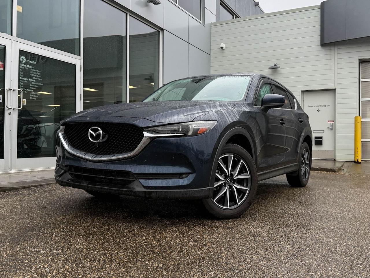 Discover the perfect blend of style, performance, and comfort with this pre-owned 2017 Mazda CX-5 GT AWD in stunning Blue. Powered by a responsive 2.5L SKYACTIV-G 4-cylinder engine paired with a smooth 6-speed automatic transmission, this AWD SUV offers confident handling and efficiency. Enjoy premium features like leather upholstery with heated front seats, a Bose premium audio system, and an integrated navigation system for a connected and luxurious drive. Safety is prioritized with advanced stability control, all-speed ABS, blind spot monitoring, and a rearview camera. With 19 machined spoke alloy wheels and sleek LED lighting, this CX-5 GT stands out in both performance and style. Ready for your next adventureschedule a test drive today!This vehicle has been registered in the province ofBritish Columbia