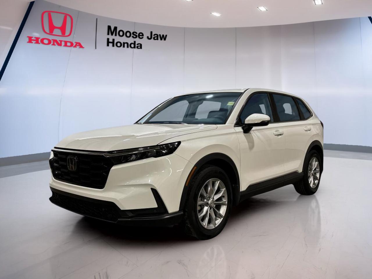 The 2023 Honda CR-V EX-L is a smart choice for daily life in Moose Jaw. This used SUV has a clean White exterior, a Black interior, and a smooth continuously variable transmission. CARFAX Canada reports no accident, which adds peace of mind. With all-wheel drive and Honda turbo power, this CR-V EX-L is ready for city streets, highway travel, and changing Prairie weather.

FEATURES OF THE CR-V Ex-L

»» Turbocharged 1.5-litre four-cylinder engine
»» Continuously variable transmission for smooth driving
»» All-wheel drive for added traction
»» Spacious two-row SUV cabin design

ADVANCED SAFETY FEATURES

»» Advanced airbag system for occupant protection
»» Anti-lock braking system for controlled stops
»» Electronic stability control helps maintain grip
»» Traction control supports slippery road driving

PERFORMANCE AND EFFICIENCY

»» 1.5-litre turbo engine delivers responsive power
»» Continuously variable transmission supports smooth acceleration
»» All-wheel drive adds year-round confidence
»» Balanced ride for city and highway

COMFORT AND CONVENIENCE

»» Dual-zone climate control adds cabin comfort
»» Four-door access makes entry very easy
»» Flexible rear seating helps daily utility
»» Quiet cabin supports relaxed long drives

TECHNOLOGY AND CONNECTIVITY

»» Clear driver information display aids awareness
»» User-friendly controls are easy to reach
»» Modern infotainment layout feels intuitive
»» Handy connectivity features support daily driving

CARGO SPACE

»» Wide rear opening eases cargo loading
»» Split-folding rear seats expand usefulness
»» Roomy cargo area suits family trips
»» Smart interior storage supports everyday items

AWARDS & RECOGNITIONS

»» Top Safety Pick, Insurance Institute for Highway Safety, 2023
»» Best Compact Utility Vehicle, Automobile Journalists Association of Canada, 2023

WHAT OTHER OWNERS LIKE

»» Smooth ride quality on rough roads
»» Useful cargo room for busy lifestyles
»» Confident all-wheel drive in winter
»» Strong fuel economy for daily commutes

Inside and out, this 2023 Honda CR-V EX-L delivers the versatility many drivers want from a modern SUV. The White finish gives it a clean, upscale look, while the Black interior keeps the cabin timeless and easy to maintain. Its practical size makes parking simple, yet it still offers the passenger room and cargo flexibility families need.

Power comes from a 1.5L 16-valve DOHC VTEC turbocharged four-cylinder engine, paired with a CVT for steady, efficient performance. The all-wheel drive system helps this 2023 Honda CR-V EX-L handle changing road conditions with added confidence. It is well suited to Saskatchewan weather, from dry summer highways to snowy winter mornings.

This SUV is built for drivers who want comfort, efficiency, and everyday usefulness in one dependable package. From commuting across Moose Jaw to weekend errands and road trips, this 2023 Honda CR-V EX-L offers the refinement and practicality that made the CR-V one of Canadas favourite utility vehicles.

This 2023 Honda CR-V Ex-Ls VIN is: 2HKRS4H71PH115570 .<p>The 2023 Honda CR-V EX-L is a smart choice for daily life in Moose Jaw. This used SUV has a clean White exterior</p>
<p> and changing Prairie weather.

FEATURES OF THE CR-V Ex-L

»» Turbocharged 1.5-litre four-cylinder engine
»» Continuously variable transmission for smooth driving
»» All-wheel drive for added traction
»» Spacious two-row SUV cabin design

ADVANCED SAFETY FEATURES

»» Advanced airbag system for occupant protection
»» Anti-lock braking system for controlled stops
»» Electronic stability control helps maintain grip
»» Traction control supports slippery road driving

PERFORMANCE AND EFFICIENCY

»» 1.5-litre turbo engine delivers responsive power
»» Continuously variable transmission supports smooth acceleration
»» All-wheel drive adds year-round confidence
»» Balanced ride for city and highway

COMFORT AND CONVENIENCE

»» Dual-zone climate control adds cabin comfort
»» Four-door access makes entry very easy
»» Flexible rear seating helps daily utility
»» Quiet cabin supports relaxed long drives

TECHNOLOGY AND CONNECTIVITY

»» Clear driver information display aids awareness
»» User-friendly controls are easy to reach
»» Modern infotainment layout feels intuitive
»» Handy connectivity features support daily driving

CARGO SPACE

»» Wide rear opening eases cargo loading
»» Split-folding rear seats expand usefulness
»» Roomy cargo area suits family trips
»» Smart interior storage supports everyday items

AWARDS & RECOGNITIONS

»» Top Safety Pick</p>
<p> 2023

WHAT OTHER OWNERS LIKE

»» Smooth ride quality on rough roads
»» Useful cargo room for busy lifestyles
»» Confident all-wheel drive in winter
»» Strong fuel economy for daily commutes

Inside and out</p>
<p> this 2023 Honda CR-V EX-L delivers the versatility many drivers want from a modern SUV. The White finish gives it a clean</p>
<p> while the Black interior keeps the cabin timeless and easy to maintain. Its practical size makes parking simple</p>
<p> yet it still offers the passenger room and cargo flexibility families need.

Power comes from a 1.5L 16-valve DOHC VTEC turbocharged four-cylinder engine</p>
<p> efficient performance. The all-wheel drive system helps this 2023 Honda CR-V EX-L handle changing road conditions with added confidence. It is well suited to Saskatchewan weather</p>
<p> and everyday usefulness in one dependable package. From commuting across Moose Jaw to weekend errands and road trips</p>
<p> this 2023 Honda CR-V EX-L offers the refinement and practicality that made the CR-V one of Canadas favourite utility vehicles.

This 2023 Honda CR-V Ex-Ls VIN is: 2HKRS4H71PH115570 .</p>