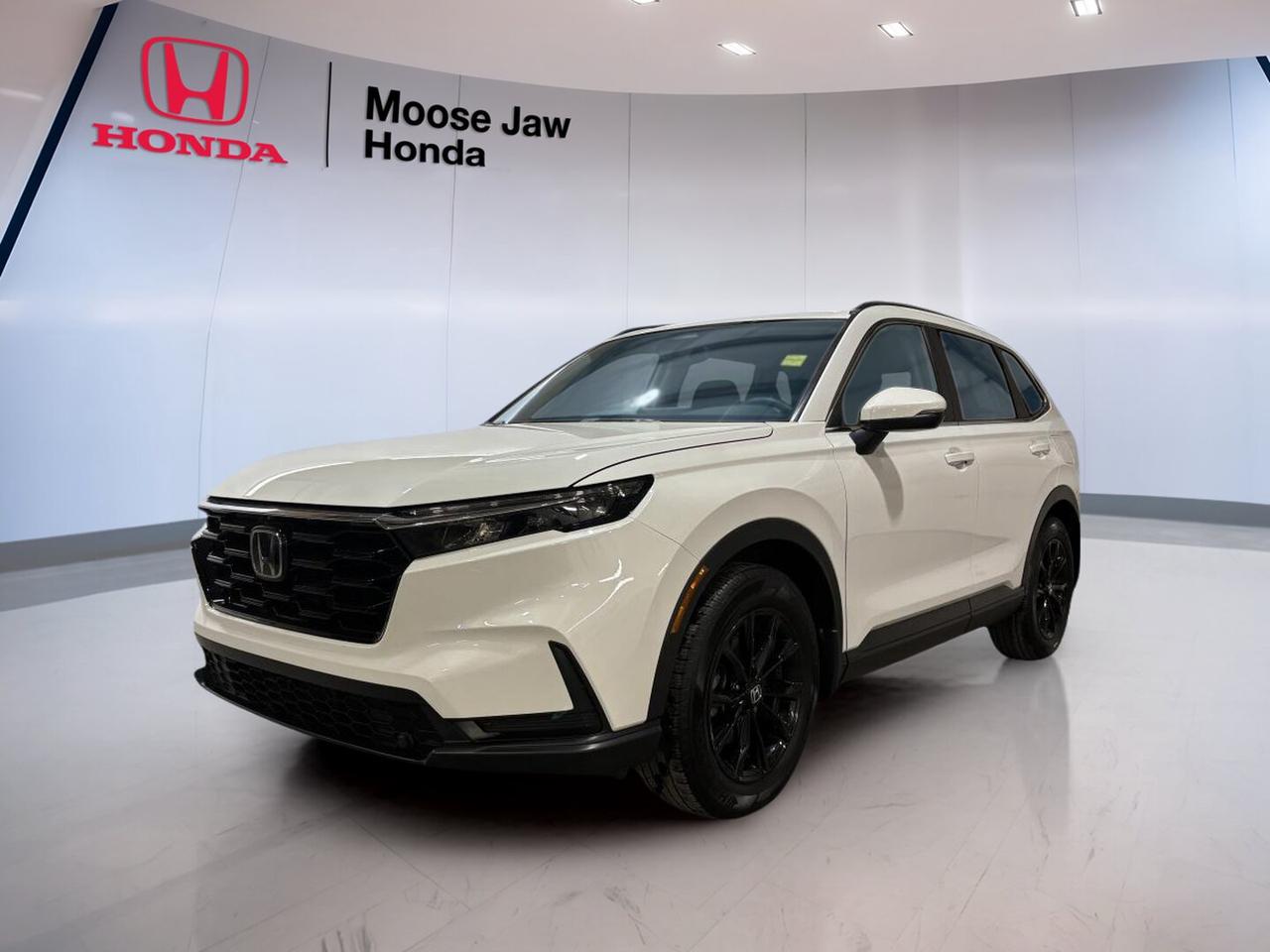 Built for busy Canadian days, the 2023 Honda CR-V Sport brings together turbocharged power, all-wheel drive confidence, and the smart versatility families want. This used SUV at Moose Jaw Honda shows 68,006 km and pairs a clean White exterior with a Black interior for a sharp, modern look.

The 2023 Honda CR-V Sport is powered by a 1.5L 16-valve DOHC VTEC turbocharged 4-cylinder engine with a continuously variable transmission. Its all-wheel drive system helps deliver secure traction through changing road and weather conditions, while the smooth power delivery makes everyday driving easy and relaxed.

FEATURES OF THE CR-V Sport
»» Turbocharged four-cylinder engine with smooth CVT
»» All-wheel drive for added year-round confidence
»» Spacious two-row SUV with flexible cabin
»» White exterior with clean modern presence

ADVANCED SAFETY FEATURES
»» Honda Sensing suite supports safer daily driving
»» Collision mitigation braking can help react
»» Lane keeping assist supports highway stability
»» Road departure mitigation adds extra reassurance

PERFORMANCE AND EFFICIENCY
»» 1.5L turbo engine balances power and economy
»» Continuously variable transmission shifts with ease
»» All-wheel drive helps in poor weather
»» Responsive handling suits city and highway

COMFORT AND CONVENIENCE
»» Spacious cabin gives passengers room to relax
»» Four doors provide easy daily access
»» Dual-purpose layout suits people and cargo
»» Black interior offers a clean appearance

TECHNOLOGY AND CONNECTIVITY
»» Clear driver displays keep info easy
»» Simple cabin layout supports quick use
»» Modern controls are easy to reach
»» Useful connectivity supports daily convenience

CARGO SPACE
»» Rear cargo area handles daily gear
»» Split-folding rear seat adds flexibility
»» Wide opening helps load larger items
»» SUV design supports family-ready practicality

AWARDS & RECOGNITIONS
»» Top Safety Pick, Insurance Institute for Highway Safety, 2023
»» Best Compact Utility Vehicle, Automobile Journalists Association of Canada, 2023

WHAT OTHER OWNERS LIKE
»» Comfortable ride quality for longer trips
»» Useful cargo room for active lifestyles
»» Confident all-wheel drive in winter
»» Smooth turbo power for everyday driving

At Moose Jaw Honda in Moose Jaw, this 2023 Honda CR-V Sport stands out as a practical and well-rounded SUV for drivers who need comfort, confidence, and proven Honda engineering. It is a smart fit for commuting, family errands, weekend travel, and life in all four seasons.

With its strong mix of efficiency, interior space, and easy drivability, the 2023 Honda CR-V Sport continues to be a favourite in the compact SUV class. If you want a used SUV that feels modern, capable, and ready for the road ahead, this CR-V Sport deserves a close look.

This 2023 Honda CR-V Sports VIN is: 2HKRS4H50PH101755.<p> modern look.

The 2023 Honda CR-V Sport is powered by a 1.5L 16-valve DOHC VTEC turbocharged 4-cylinder engine with a continuously variable transmission. Its all-wheel drive system helps deliver secure traction through changing road and weather conditions</p>
<p> while the smooth power delivery makes everyday driving easy and relaxed.

FEATURES OF THE CR-V Sport
»» Turbocharged four-cylinder engine with smooth CVT
»» All-wheel drive for added year-round confidence
»» Spacious two-row SUV with flexible cabin
»» White exterior with clean modern presence

ADVANCED SAFETY FEATURES
»» Honda Sensing suite supports safer daily driving
»» Collision mitigation braking can help react
»» Lane keeping assist supports highway stability
»» Road departure mitigation adds extra reassurance

PERFORMANCE AND EFFICIENCY
»» 1.5L turbo engine balances power and economy
»» Continuously variable transmission shifts with ease
»» All-wheel drive helps in poor weather
»» Responsive handling suits city and highway

COMFORT AND CONVENIENCE
»» Spacious cabin gives passengers room to relax
»» Four doors provide easy daily access
»» Dual-purpose layout suits people and cargo
»» Black interior offers a clean appearance

TECHNOLOGY AND CONNECTIVITY
»» Clear driver displays keep info easy
»» Simple cabin layout supports quick use
»» Modern controls are easy to reach
»» Useful connectivity supports daily convenience

CARGO SPACE
»» Rear cargo area handles daily gear
»» Split-folding rear seat adds flexibility
»» Wide opening helps load larger items
»» SUV design supports family-ready practicality

AWARDS & RECOGNITIONS
»» Top Safety Pick</p>
<p> 2023

WHAT OTHER OWNERS LIKE
»» Comfortable ride quality for longer trips
»» Useful cargo room for active lifestyles
»» Confident all-wheel drive in winter
»» Smooth turbo power for everyday driving

At Moose Jaw Honda in Moose Jaw</p>
<p> this 2023 Honda CR-V Sport stands out as a practical and well-rounded SUV for drivers who need comfort</p>
<p> the 2023 Honda CR-V Sport continues to be a favourite in the compact SUV class. If you want a used SUV that feels modern</p>