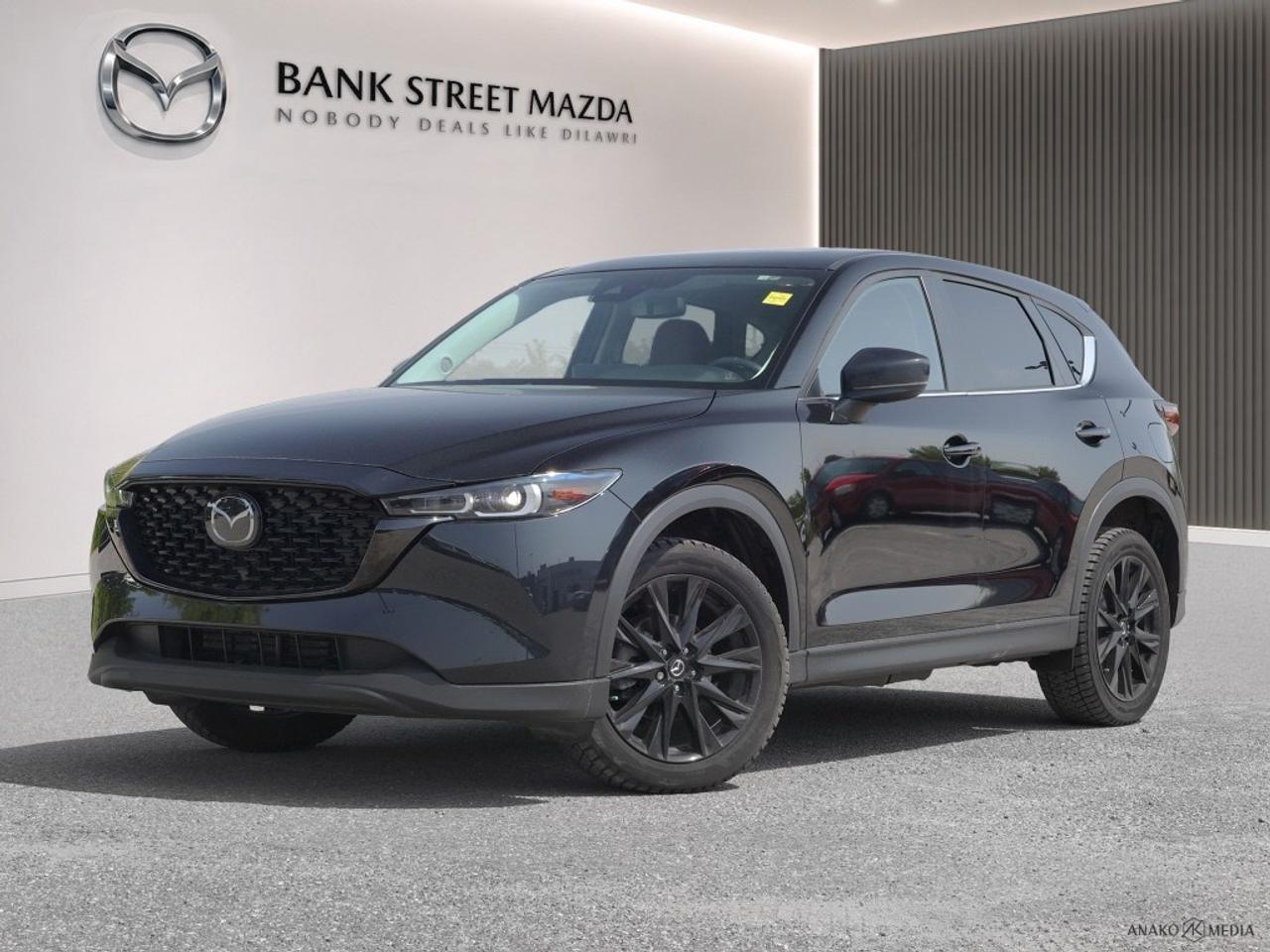 Experience the thrill of driving a 2022 Mazda CX-5 GS AWD, presented in a stunning black finish, complete with an automatic transmission and all-wheel drive that ensures exceptional handling no matter the terrain. The sleek SUV design boasts alloy wheels and a distinctive black exterior that is sure to impress. Inside, comfort meets functionality with features such as heated seats and power-adjustable seating, all accentuated by keyless entry for convenience. Stay connected and safe with the latest in smart device integration and Bluetooth connectivity, while driver assistance features including lane assist and a backup camera enhance your journey. Ensuring peace of mind, the Mazda CX-5 is equipped with brake assist and cruise control, allowing you to drive with confidence. This versatile SUV is perfect for families and adventurers alike. Get in touch with Bank Street Mazda to learn more about how the Mazda CX-5 can enhance your driving experience.
