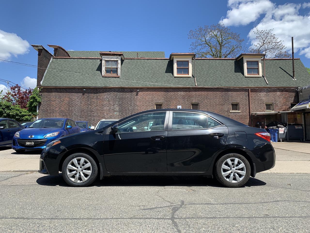 2015 Toyota Corolla 4dr Sdn CVT LE Photo