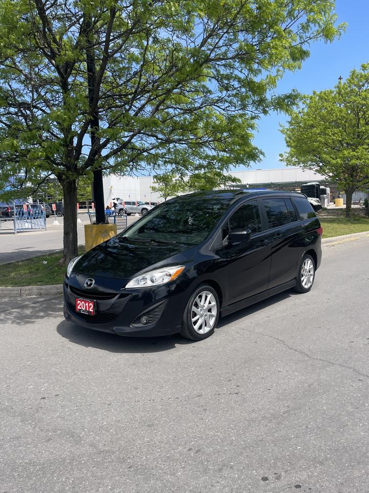 <p>WOW!!CHECK OUT THIS MAZDA 5 GT FINISHED IN BEAUTIFUL BRILLIANT BLACK!!ONLY 149,000 ORIGINAL KMS!!2.5L 4 CYLINDER!!AUTOMATIC!!TILT AND CRUISE CONTROL!!POWER WINDOWS AND LOCKS!!HEATED SEATS!!BLACK LEATHER WITH RED PIPING!!BLUETOOTH READY!!ICE COLD FRONT AND REAR AIR CONDITION!!POWER SUNROOF!!ALLOYS!!1 OWNER!!NO ACCIDENTS, CARFAX INCLUDED!!AUTOGARD ADVANTAGE WARRANTIES AVAILABLE!!FULLY CERTIFIED FOR ONLY $ 7,999 + HST AND LICENSING</p><p style=text-align: center;>&nbsp;</p><p style=text-align: center;>PLEASE CALL OR TEXT 416 822-5204!!</p><p style=text-align: center;>WE FINANCE!! GOOD, BAD, NO CREDIT!!&nbsp;</p><p style=text-align: center;>EXTENDED WARRANTIES AVAILABLE ON ALL VEHICLES!!</p>