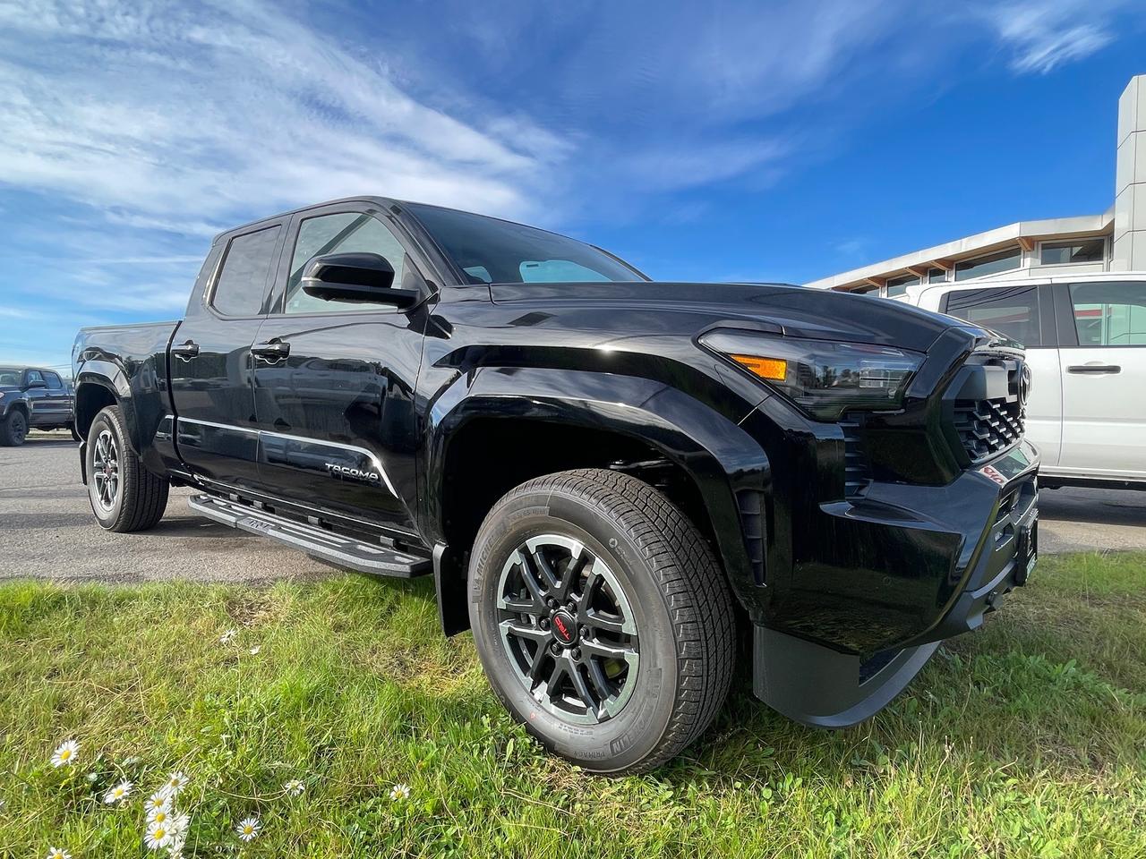 <p>Get ready to experience the all-new 2026 Toyota Tacoma, now available at Smithers Toyota! This isnt just any pickup truck; its a rugged, capable, and technologically advanced machine built to conquer any adventure you throw its way. Whether youre navigating the demanding terrain of Northern BC or heading out for a weekend escape, the 2026 Tacoma is engineered to perform. Its bold black grille and body-coloured bumpers give it a commanding presence, while the deep-tinted glass and LED brakelights add a touch of modern style. Inside, youll find a comfortable and functional cabin designed for both work and play, featuring premium SofTex seat trim and a host of convenience features.</p><p>&nbsp;</p><p>This new 2026 Toyota Tacoma is packed with features designed to enhance your driving experience and provide peace of mind. The 2.4L Turbo 4-Cylinder engine delivers impressive power and efficiency, while the 8-speed automatic transmission ensures smooth gear changes. With its 4-wheel drive capability and advanced suspension systems, you can tackle challenging roads with confidence. Plus, the Tacoma comes equipped with a suite of advanced safety technologies, including Blind Spot Monitor and Rear Cross Traffic Alert, to help you stay aware of your surroundings.</p><p>&nbsp;</p><p>Here are 5 features that truly make this 2026 Toyota Tacoma stand out:</p><p><br><br></p><ul><li><strong>Tacoma TRD Sport Premium Package:</strong> Elevate your driving with this exclusive package, designed for those who demand sportier performance and premium comfort.</li></ul><p>&nbsp;</p><ul><li><strong>Full-Speed Range Dynamic Radar Cruise Control:</strong> Enjoy a more relaxed drive on the highway as this intelligent system automatically adjusts your speed to maintain a safe distance from the vehicle ahead.</li></ul><p>&nbsp;</p><ul><li><strong>Blind Spot Monitor (BSM) and Rear Cross Traffic Alert (RCTA):</strong> These advanced safety features provide an extra layer of awareness, alerting you to vehicles in your blind spots and when backing out of parking spaces.</li></ul><p>&nbsp;</p><ul><li><strong>2.4L Turbo 4-Cylinder Engine:</strong> Experience exhilarating power and responsive acceleration from this potent and efficient turbocharged engine, ready for any task.</li></ul><p>&nbsp;</p><ul><li><strong>Multi-link rear suspension w/coil springs:</strong> Enjoy a smoother, more controlled ride, whether youre on the pavement or venturing off the beaten path.</li></ul><p><br><br></p><p><strong><em>Powered by AutoIntelligence&trade;</em></strong></p><p>&nbsp;</p><p>Vehicle information has been generated using artificial intelligence and is provided for informational purposes only. While efforts are made to ensure accuracy, please confirm all details directly with the dealer.</p><p>&nbsp;</p>