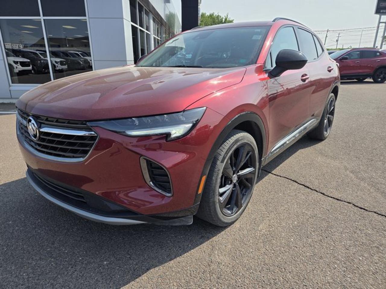 Recent Arrival!Cinnabar Metallic 2022 Buick Envision Preferred AWD 9-Speed Automatic 2.0L Turbocharged3.47 Final Drive Axle Ratio, 4-Wheel Disc Brakes, 7 Speakers, ABS brakes, Air Conditioning, Alloy wheels, AM/FM radio: SiriusXM, AppLink/Apple CarPlay and Android Auto, Auto High-beam Headlights, Auto-dimming door mirrors, Auto-dimming Rear-View mirror, Automatic temperature control, Black Roof Rack Cross Rails, Block heater, Body Colour Door Handles, Brake assist, Bumpers: body-colour, Carpeted Front & Rear Floor Mats, Cloth w/Leatherette Seat Trim, Compass, Delay-off headlights, Driver 4-Way Power Lumbar Seat Adjuster, Driver 8-Way Power Seat Adjuster, Driver door bin, Driver vanity mirror, Dual front impact airbags, Dual front side impact airbags, Electronic Stability Control, Emergency communication system: OnStar and Buick connected services capable, Enhanced Performance 7-Speaker Audio System, Four wheel independent suspension, Front anti-roll bar, Front Bin Centre Console USB Ports, Front Bucket Seats, Front dual zone A/C, Front Passenger 6-Way Manual Seat Adjuster, Front reading lights, Fully automatic headlights, Heated door mirrors, Heated Driver & Front Passenger Seats, Heated front seats, Heated Steering Wheel, Heated steering wheel, Illuminated entry, Knee airbag, Lane Change Alert w/Side Blind Zone Alert, Low tire pressure warning, Lower Trim/Wheel Arch Mouldings, Occupant sensing airbag, Outside temperature display, Overhead airbag, Overhead console, Panic alarm, Passenger door bin, Passenger vanity mirror, Power door mirrors, Power driver seat, Power Liftgate, Power steering, Power windows, Preferred Equipment Group 1SC, Premium Seat Package, Radio data system, Radio: Buick Infotainment System AM/FM Stereo, Rear anti-roll bar, Rear Cargo Compartment Cover, Rear Cross Traffic Alert, Rear reading lights, Rear window defroster, Rear window wiper, Remote keyless entry, Roof rack: rails only, Safety Package, Security system, SiriusXM, Speed control, Split folding rear seat, Spoiler, Sport Alloy Pedals, Sport Touring Package, Steering wheel mounted audio controls, Telescoping steering wheel, Tilt steering wheel, Traction control, Trailer Hitch (LPO), Trip computer, USB Charging-Only Ports, Variably intermittent wipers, Wheels: 18 Aluminum w/Light Charcoal Met Finish, Wheels: 20 Aluminum w/Dark Finish, Wireless Apple CarPlay/Wireless Android Auto.At Steele GMC Buick Fredericton, were proud to be your Used Car Mega Center serving drivers all across Atlantic Canada from Fredericton, Oromocto, New Maryland, Woodstock, Saint John, and Moncton in New Brunswick, to Nova Scotia, Prince Edward Island, and Newfoundland. Our inventory features all makes and models of used cars, trucks, SUVs, and vans, giving you the best selection in the region. Whether you need a fuel-efficient sedan, a family SUV, or a rugged pickup, youll find it right here at Steele GMC Buick Fredericton. With our Market Value Pricing, every vehicle is priced based on real-time market conditions, ensuring you get the best possible deal without the hassle of negotiating. We keep pricing transparent and competitive so you can shop with total confidence. No matter your credit situation good, bad, or no credit at all youre approved. Our finance experts work with lenders across Atlantic Canada to find the best terms for your budget, including second-chance financing, newcomer programs, and credit rebuilding solutions. As part of Steele Auto Group, Atlantic Canadas most diversified automotive group with 47 dealerships representing 27 brands, we offer unmatched selection, buying power, and customer support. That means if the vehicle you want isnt on our Fredericton lot, we can source it quickly from our massive dealer network across the Maritimes. When it comes to used vehicles, Steele GMC Buick Fredericton is the destination for drivers all across Atlantic Canada delivering market value pricing, eve