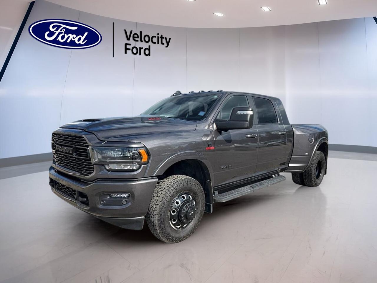 // ACCIDENT FREE!! //

This 2024 RAM 3500 Limited 4x4 Mega Cab 64 Box is a heavy-duty diesel truck built for serious work and long-haul comfort. Offered by Velocity Ford in Moose Jaw, this used pickup shows 93,797 km, comes in Grey with a Black interior, and CARFAX Canada reports no accident history.

Power comes from a 6.7-litre diesel engine paired with an automatic transmission and four-wheel drive. This setup gives this 2024 RAM 3500 Limited 4x4 Mega Cab 64 Box the strength needed for demanding jobs, while the Mega Cab layout adds impressive passenger room and practical in-cab storage.

FEATURES OF THE 3500 Limited 4x4 Mega Cab 64 Box
»» Mega Cab adds exceptional rear passenger room
»» 6.7-litre diesel delivers strong pulling power
»» Limited trim brings premium comfort features
»» Four-wheel drive supports confident year-round traction

TRUCK FEATURES
»» Towing capacity rated at 6,481 kg
»» Rear tow hook supports work-ready utility
»» Off-road tires add extra surface grip
»» Retractable mirrors help with trailer visibility

ADVANCED SAFETY FEATURES
»» Backup camera helps with reversing confidence
»» Blind spot monitor adds lane-change awareness
»» Stability control helps maintain road composure
»» Side and head airbags add protection

PERFORMANCE AND EFFICIENCY
»» 6.7-litre diesel engine for heavy-duty strength
»» Automatic transmission supports smooth power delivery
»» Four-wheel drive for added traction control
»» Limited slip differential aids slippery conditions

COMFORT AND CONVENIENCE
»» Heated front seats for cold mornings
»» Heated rear seats add passenger comfort
»» Dual-zone climate control balances cabin temperatures
»» Memory seats and pedals ease daily driving

TECHNOLOGY AND CONNECTIVITY
»» Navigation system helps guide every trip
»» Bluetooth integration supports hands-free communication
»» WiFi hotspot keeps devices better connected
»» Steering wheel audio controls simplify access

CARGO SPACE
»» 64 box handles tools and supplies
»» Four-door cab improves loading flexibility
»» Rear trunk access supports cabin storage use
»» Spare tire adds peace of mind

AWARDS & RECOGNITIONS
»» Best Resale Value, Canadian Black Book, 2024

WHAT OTHER OWNERS LIKE
»» Strong diesel torque for towing confidence
»» Mega Cab rear space for passengers
»» Comfortable ride for a heavy-duty truck
»» Premium features that suit daily driving

This RAM balances hard-working capability with upscale convenience. It includes cruise control, power steering, anti-lock braking system, power windows, heated mirrors, electric mirrors, automatic headlights, fog lights, tinted windows, push button start, auto-dimming rearview mirror, LED headlamps, and turn signal mirrors.

Inside, this truck is well equipped for daily comfort and long trips. You get front air conditioning, automatic climate control, driver and passenger lumbar support, power front seats, memory mirrors, illuminated vanity mirrors, rear window defroster, satellite radio, HD Radio, and a clean, practical four-door layout.

For peace of mind on the road, this pickup also includes tire pressure monitoring, child safety locks, passenger airbag sensor, automatic door locks, driver airbag, passenger airbag, and anti-lock braking support. The result is a capable and refined heavy-duty truck ready for towing, travel, and demanding Canadian conditions.

This 2024 RAM 3500 Limited 4x4 Mega Cab 64 Boxs VIN is: 3C63RRPL9RG256693.