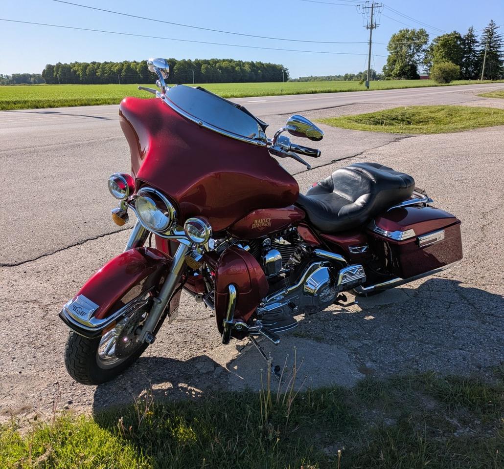 <p class=MsoNormal><span style=font-size: 14.0pt; line-height: 107%; font-family: Aptos,sans-serif;>It&rsquo;s a beautiful thing! A 2004 Electra Glide Classic FLHTCI with 89,900 kms. In Sierra Red Pearl with color-matched inner fairing.</span></p><p class=MsoNormal><span style=font-size: 14.0pt; line-height: 107%; font-family: Aptos,sans-serif;>This fully dressed touring machine is powered by the 88ci (1450cc) Twin Cam EFI engine with 5-speed Transmission.</span></p><p class=MsoNormal><span style=font-size: 14.0pt; line-height: 107%; font-family: Aptos,sans-serif;>Loaded with premium features, lots of chrome accents and a Wireless / Bluetooth Receiver Controller and Mini-Ape handle bars.</span></p><p class=MsoNormal><span style=font-size: 14.0pt; line-height: 107%; font-family: Aptos,sans-serif;>Vance & Hines True-Dual Exhaust</span></p><p class=MsoNormal><span style=font-size: 14.0pt; line-height: 107%; font-family: Aptos,sans-serif;>Front lower fairings with Cerwin-Vega speakers, comes with the large Tour-Pack and hard saddlebags, for those long-distance rides.</span></p><p class=MsoNormal><a name=_Hlk211499882></a><span style=font-size: 14.0pt; line-height: 107%; font-family: Aptos,sans-serif;>Clean CARFAX Report. No accidents or damage claims recorded. Selling Safety Inspected & Certified.</span></p><p class=MsoNormal><span style=mso-bookmark: _Hlk211499882;><span style=font-size: 14.0pt; line-height: 107%; font-family: Aptos,sans-serif;>Asking $7,995 +13% HST and Vehicle Registration/Licencing requirements.</span></span></p><p class=MsoNormal><span style=mso-bookmark: _Hlk211499882;><span style=font-size: 14.0pt; line-height: 107%; font-family: Aptos,sans-serif;>Offered by Thames Auto Sales. </span></span><a href=http://www.thamesautosales.ca><span style=mso-bookmark: _Hlk211499882;><span style=font-size: 14.0pt; line-height: 107%; font-family: Aptos,sans-serif;>www.thamesautosales.ca</span></span></a><span style=mso-bookmark: _Hlk211499882;><span style=font-size: 14.0pt; line-height: 107%; font-family: Aptos,sans-serif;> Now under new ownership and management, effective June 1, 2025.</span></span></p><p class=MsoNormal>&nbsp;</p>
