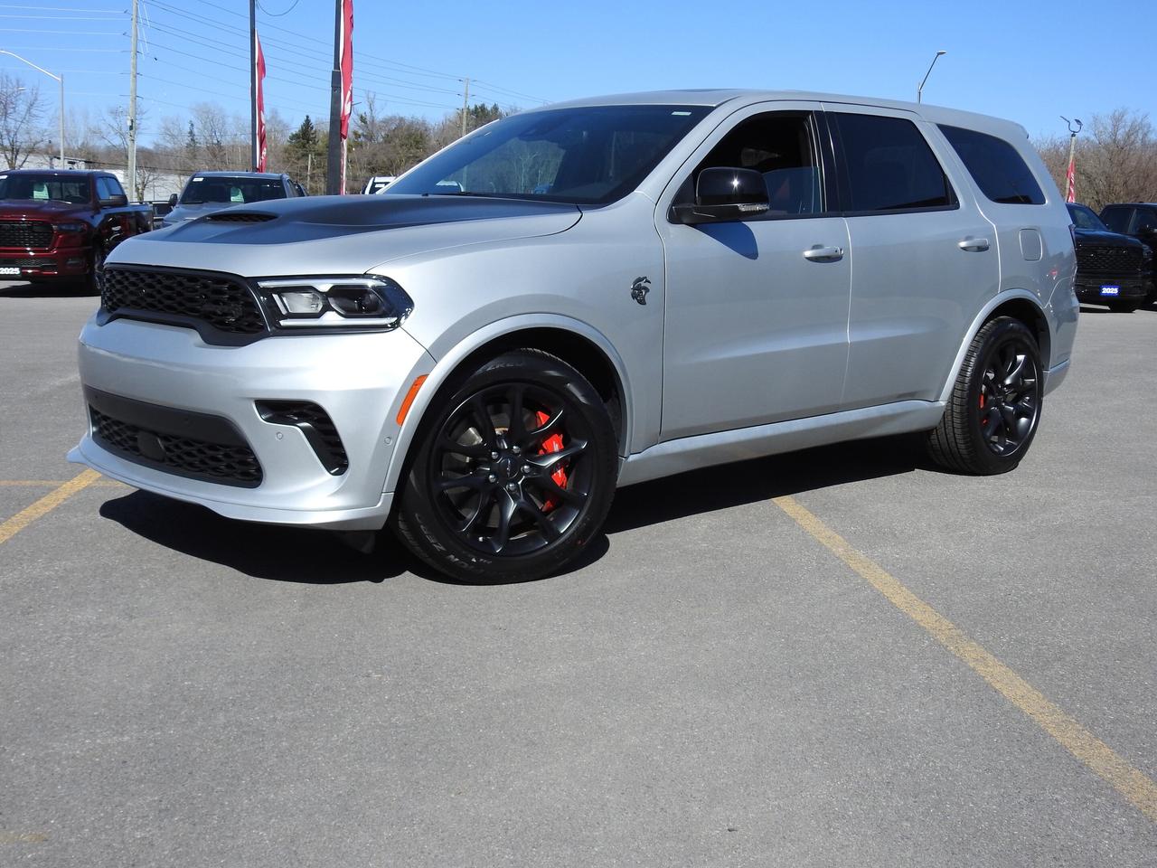 2025 DODGE DURANGO SRT HELLCAT SILVER BULLET AWD.  ADVERTISED PRICE INCLUDES LUXURY TAX.  6.2L HEMI ENGINE WITH 8 SPEED AUTO TRANSMISSION.  POWER SUNROOF,  NAPPA LEATHER HIGH PERFORMANCE SEATS, HARMON KARDON SOUND SYSTEM, HEATED & COOLED SEATS, REMOTE START, POWER LIFTGATE, 10.1" SCREEN WITH NAVIGATION, ADAPTIVE CRUISE CONTROL, BLIND SPOT MONITOR WITH TRAILER DETECTION, LANE KEEP ASSIST, TRAILER BRAKE CONTROLLER, 4 & 7 PIN WIRING HARNESS WITH CLASS IV HITCH RECEIVER, ADVANCED BRAKE ASSIST, FULL SPEED FORWARD COLLISION WARNING PLUS, FORGED CARBON FIBRE INTERIOR ACCENTS, ECLIPSE BLACK EXHUAST TIPS, HEATED STEERING WHEEL, FRONT & REAR PARK ASSIST, COMPETITION SUSPENSION, PERFORMANCE LOWER SPLITTER, BREMBO BRAKES, & MORE!  ONLY HST EXTRA.