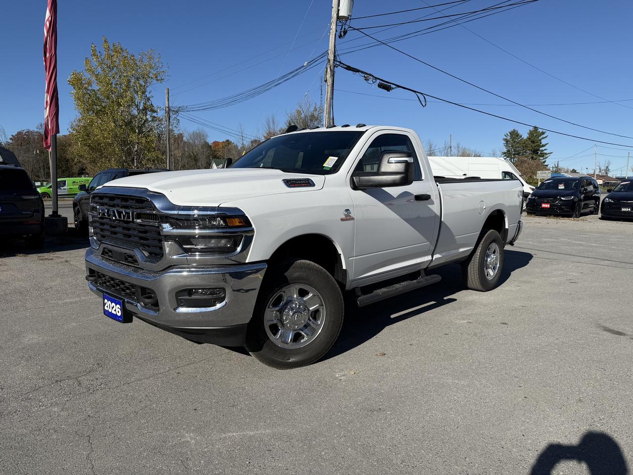 2026 RAM 2500 TRADESMAN REGULAR CAB 4X4.  6.7L H/O CUMMINS DIESEL ENGINE WITH 8 SPEED AUTO TRANSMISSION.  8.4" SCREEN WITH NAVIGATION, BLACK MOPAR SIDE STEPS, MOPAR DEPLOYABLE BED STEP, SPRAY IN BEDLINER, DUAL ZONE CLIMATE CONTROL, ANTI-SPIN DIFFERENTIAL REAR AXLE, MOPAR ALL WEATHER FLOOR MATS, CLEARANCE LAMPS, TRANSFER CASE SKID PLATE SHIELD, REAR SLIDING WINDOW, POWER FOLDING SIDE MIRRORS, UPGRADED DOOR TRIM PANEL, LED BED LIGHTING, FORWARD COLLISION WARNING PLUS, PEDESTRIAN/CYCLIST EMERGENCY BRAKING, ADAPTIVE CRUISE CONTROL, ENGINE BLOCK HEATER, CLASS V HITCH RECEIVER, & MORE!  ONLY HST EXTRA.