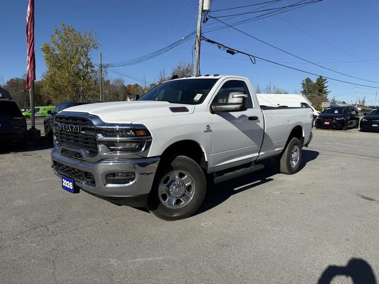2026 RAM 2500 TRADESMAN REG CAB 4X4.  6.7L CUMMINS TURBO DIESEL ENGINE WITH 8 SPEED AUTO TRANSMISSION.  12" SCREEN WITH NAVIGATION, MOPAR DEPLOYABLE BED STEP, SPRAY IN BEDLINER, CLEARANCE LAMPS, MOPAR ALL WEATHER MATS, REAR WHEELHOUSE LINERS, TRANSFER CASE SKID PLATE SHIELD, MOPAR SIDE STEPS, DUAL ZONE CLIMATE CONTROL, REAR SLIDING WINDOW, ADAPTIVE CRUISE CONTROL, FORWARD COLLISION WARNING PLUS, PEDESTRIAN/CYCLIST EMERGENCY BRAKING, 4 & 7 PIN WIRING HARNESS WITH CLASS V HITCH, & MORE!  ONLY HST EXTRA.
