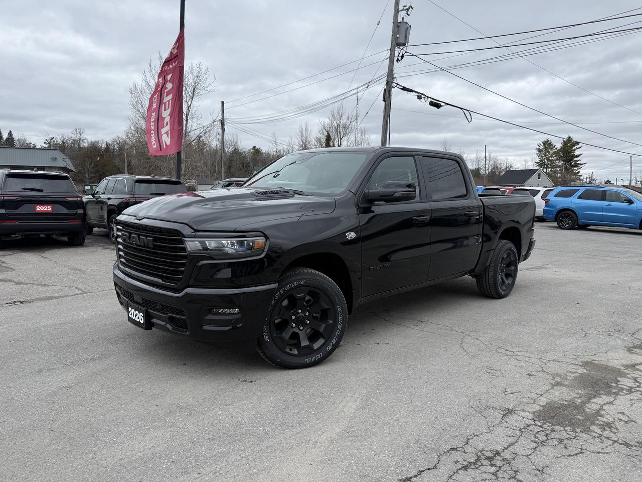 2026 RAM 1500 SPORT CREW CAB 4X4.  5.7L HEMI ENGINE WITH 8 SPEED AUTO TRANSMISSION.  PANORAMIC SUNROOF, HARMON KARDON SOUND SYSTEM, 14" SCREEN WITH NAVIGATION, LEATHER HEATED & COOLED SEATS, DUAL WIRELESS CHARGIN PADS, POWER DRIVER & PASSENGER SEATS WITH DRIVER MEMORY SETTINGS, 3.92 REAR AXLE RATIO, TRAILER BRAKE CONTROLLER, POWER TAILGATE, PASSENGER SCREEN, POWER ADJUSTABLE PEDALS, ADAPTIVE CRUISE CONTROL, BLIND SPOT MONITOR WITH REAR CROSS PATH DETECTION, 360 SURROUND VIEW CAMERA, FRONT & REAR PARK ASSIST, ACTIVE LANE MANAGEMENT SYSTEM, ADVANCED BRAKE ASSIST, REMOTE START, HEATED STEERING WHEEL, 2ND ROW HEATED SEATS, & MORE!  ONLY HST EXTRA.