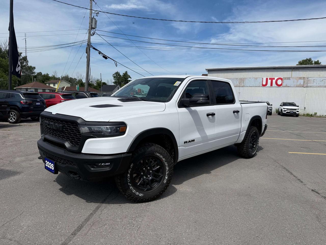 2026 RAM 1500 REBEL CREW CAB 4X4.  3.0L HURRICANE ENGINE WITH 3.92 REAR AXLE RATIO.  PANORAMIC SUNROOF, HARMON KARDON SOUND SYSTEM, HEATED SEATS & STEERING WHEEL, REMOTE START, 14.4" SCREEN WITH NAVIGATION, POWER DRIVER & PASSENGER SEATS WITH DRIVER MEMORY SETTINGS, DUAL WIRELESS CHARGING PADS, 2ND ROW HEATED SEATS, POWER TAILGATE, POWER ADJUSTABLE PEDALS, ADAPTIVE CRUISE CONROL, BLIND SPOT MONITOR WITH REAR CROSS PATH DETECTION, FORWARD COLLISION WARNING PLUS, AUTO HIGH BEAM CONTROL, ACTIVE LANE MANAGEMENT SYSTEM, DUAL ZONE CLIMATE CONTROL, FRONT PASSENGER SCREEN, & MORE!  ONLY HST EXTRA.