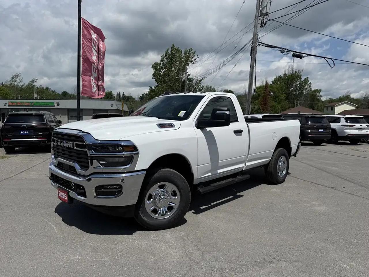 2026 RAM 2500 TRADESMAN REGULAR CAB 4X4. 6.4L HEMI ENGINE WITH 8 SPEED AUTO TRANSMISSION. 12" SCREEN WITH NAVIGATION, MOPAR DEPLOYABLE BED STEP, REAR SLIDING WINDOW, MOPAR SIDE STEPS, SPRAY IN BEDLINER, CLEARANCE LAMPS, FRONT & REAR PARK ASSIST, DUAL ZONE CLIMATE CONTROL, ANTI-SPIN DIFFERENTIAL REAR AXLE, LED BED LIGHTING, ADAPTIVE CRUISE CONTROL, PEDESTRIAN/CYCLIST EMERGENCY BRAKING, FORWARD COLLISION WARNING PLUS, CLASS V HITCH WITH 4 & 7 PIN WIRING HARNESS, TRAILER SWAY CONTROL, REAR WHEELHOUSE LINERS, & MORE! ONLY HST EXTRA