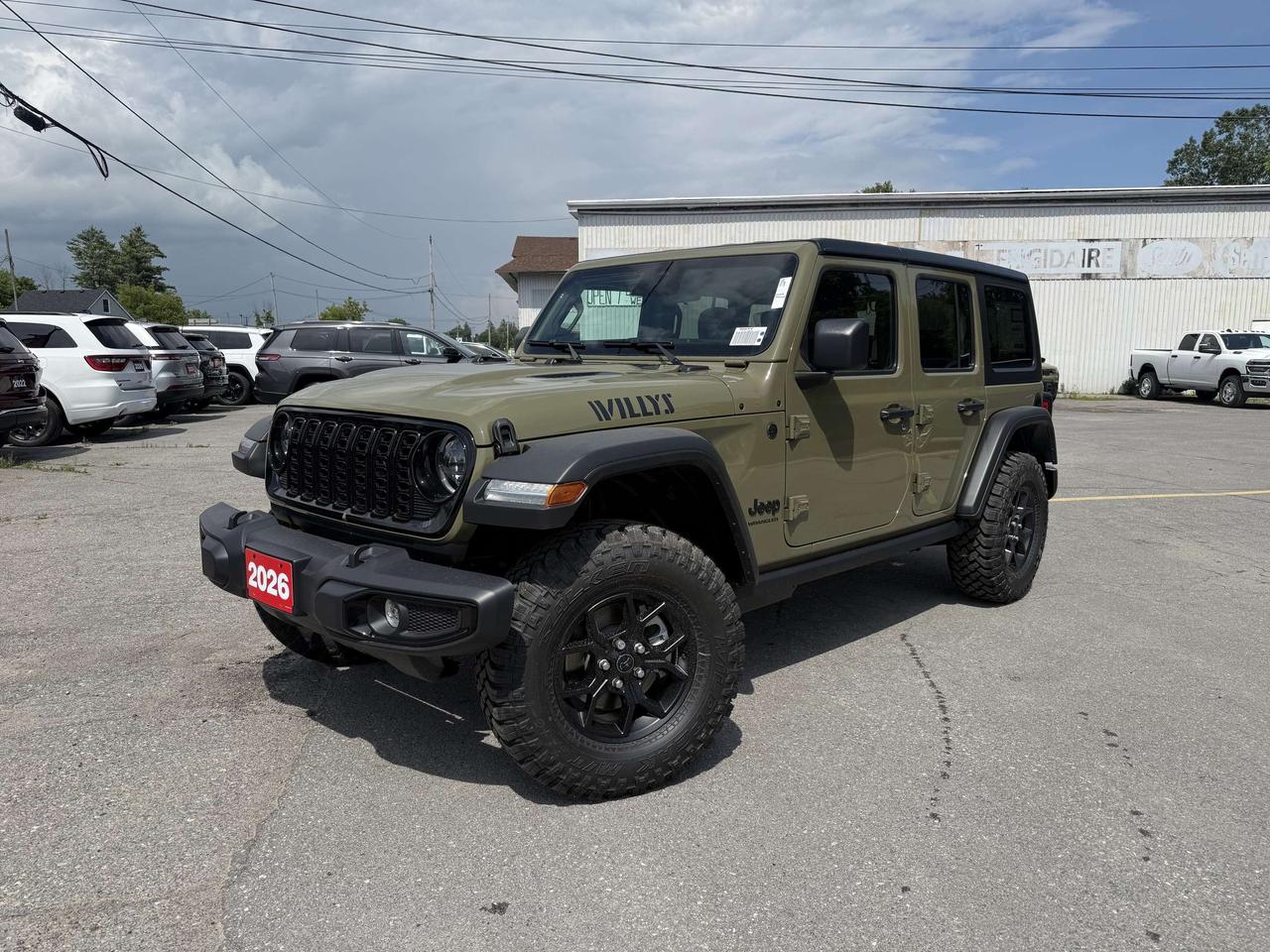 2026 JEEP WRANGLER WILLYS 4X4 4 DOOR.  3.6L PENTASTAR ENGINE WITH 8 SPEED AUTO TRANSMISSION.  12.3" SCREEN WITH APPLE CARPLAY OR ANDROID AUTO, LEATHER HEATED SEATS & STEERING WHEEL, REMOTE START, ALPINE SOUND SYSTEM, CORNING GORILLA GLASS, 4.10 REAR AXLE RATIO, DANA M210 WIDE HEAVY-DUTY TUBE FRONT AXLE, DANA M220 WIDE REAR AXLE, ROCK PROTECTION SILL RAILS, ENHANCED ADAPTIVE CRUISE CONTROL, ADVANCED BRAKE ASSIST, FORWARD COLLISION WARNING PLUS, 3 PIECE HARDTOP, UNIVERSAL GARAGE DOOR OPENER, & MORE!  ONLY HST EXTRA.  *ADVERTISED FINANCE PAYMENT IS PRE-TAX OVER 96 MONTHS WEEKLY AT 5.29%, WITH $0 DOWN, OAC.