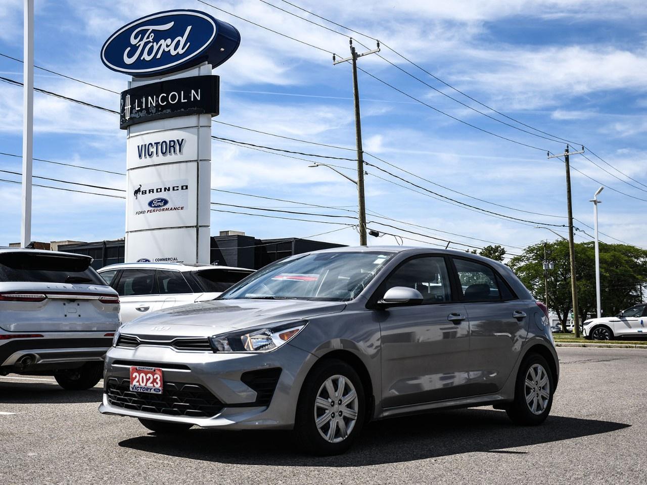 <h2>NOW AVAILABLE AT VICTORY FORD LINCOLN</h2><h1>2023 Kia Rio LX+ Automatic</h1><h3>Fuel-Efficient Performance  Advanced Safety Features  Automatic Transmission  Exceptional Value</h3><p>This 2023 Kia Rio LX+ Automatic delivers outstanding fuel economy, modern technology, and everyday practicality in a stylish compact sedan. With its efficient powertrain, user-friendly features, and comfortable interior, the Rio is an ideal choice for commuters, first-time buyers, and anyone looking for reliable transportation with excellent value.</p><h3>POWER & PERFORMANCE</h3><ul><li><p>1.6L 4-Cylinder Engine</p></li><li><p>Intelligent Variable Transmission (IVT)</p></li><li><p>Front-Wheel Drive (FWD)</p></li><li><p>120 Horsepower / 112 lb-ft Torque</p></li><li><p>Excellent Fuel Economy</p></li><li><p>Smooth & Responsive Driving Dynamics</p></li></ul><h3>PACKAGE</h3><ul><li><p>LX+ Package</p></li><li><p>Automatic Transmission</p></li><li><p>Heated Front Seats</p></li><li><p>Heated Steering Wheel</p></li><li><p>Remote Keyless Entry</p></li><li><p>Forward Collision Avoidance Assist</p></li></ul><h3>EXTERIOR FEATURES</h3><ul><li><p>Modern Kia Styling</p></li><li><p>Body-Colour Exterior Accents</p></li><li><p>15" Steel Wheels with Covers</p></li><li><p>Automatic Headlights</p></li><li><p>Compact & Easy-to-Maneuver Design</p></li><li><p>Aerodynamic Exterior Profile</p></li></ul><h3>INTERIOR & COMFORT</h3><ul><li><p>Premium Cloth Seating Surfaces</p></li><li><p>Heated Front Seats</p></li><li><p>Heated Steering Wheel</p></li><li><p>Air Conditioning</p></li><li><p>60/40 Split-Folding Rear Seat</p></li><li><p>Comfortable & Functional Cabin Layout</p></li></ul><h3>TECHNOLOGY</h3><ul><li><p>8" Touchscreen Display</p></li><li><p>Apple CarPlay® & Android Auto</p></li><li><p>Bluetooth® Hands-Free Connectivity</p></li><li><p>USB Connectivity</p></li><li><p>Rearview Camera Display</p></li><li><p>Steering Wheel Mounted Controls</p></li></ul><h3>SAFETY & DRIVER ASSISTANCE</h3><ul><li><p>Forward Collision Avoidance Assist</p></li><li><p>Lane Keeping Assist</p></li><li><p>Lane Follow Assist</p></li><li><p>Driver Attention Warning</p></li><li><p>Electronic Stability Control</p></li><li><p>Rearview Camera</p></li><li><p>Tire Pressure Monitoring System</p></li></ul><h3>HIGHLIGHTS</h3><ul><li><p>LX+ Package</p></li><li><p>Automatic Transmission</p></li><li><p>Heated Front Seats & Steering Wheel</p></li><li><p>Apple CarPlay® & Android Auto</p></li><li><p>Advanced Driver Assistance Features</p></li><li><p>Outstanding Fuel Economy</p></li></ul><h3>Special Offer:</h3><p><strong>Peace of Mind Included:</strong> 3-Month Comprehensive Warranty (for vehicles under 10 years old & under 160,000 km) No-Haggle, Live Market Pricing  Transparent & Competitive All-Inclusive Pricing: Fees, Reconditioning, and Full Detailing Included (Taxes & Licensing Extra)</p><h4>Additional Details:</h4><p><strong>Keys:</strong> Standard with one key. Additional keys (if provided by the previous owner) included at no cost. Optional key purchases available upon request.</p><p><strong>Visit Victory Ford Lincoln Today</strong> Schedule your appointment to experience this exceptional vehicle.</p>