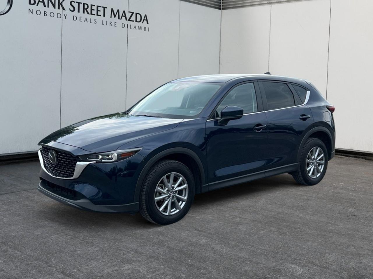Experience the charm of the 2024 Mazda CX-5 GS AWD with its rich design and dynamic performance. This SUV, in a timeless color, offers all-wheel drive for those seeking confidence in handling across various terrains. The exterior boasts stylish alloy wheels, enhancing its road presence, while inside, youll find a thoughtfully designed cabin with comfortable heated seats, perfect for Canadian winters. A touch of modern convenience is evident with features like power seats and power windows. Stay connected and entertained with smart device integration and a crystal-clear Bluetooth connection, all while relying on the advanced backup camera for effortless parking. Safety is a priority with lane assist and brake assist, ensuring peace of mind on every journey. Perfect for tech-savvy individuals or families who value safety and comfort, this Mazda is ready to meet your needs. Contact Bank Street Mazda today for more information, and let this exceptional vehicle become a part of your daily adventures.
