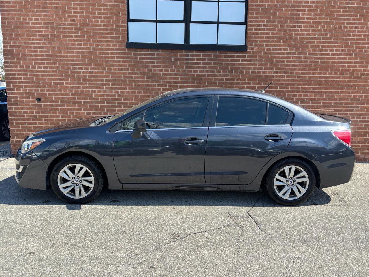 2016 Subaru Impreza 4dr Sdn CVT 2.0i w/Sport Pkg Photo
