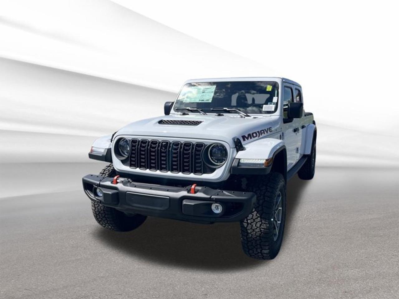 Brand new and built for serious desert-rated fun, the 2026 Jeep Gladiator Mojave X is ready for Halifax roads, trails, and worksites. This white 4-door truck pairs a black interior with automatic transmission, 4-wheel drive, and Jeeps proven 3.6-litre Pentastar V-6 gas engine for confident everyday capability.At Steele Halifax Chrysler Dodge Jeep Ram FIAT, this new 2026 Jeep Gladiator Mojave X delivers the open-air freedom Jeep is known for, along with rugged truck utility. Its bold design, practical cabin layout, and focused off-road engineering make it a smart choice for drivers who want adventure and real pickup versatility.FEATURES OF THE Gladiator Mojave XDesert-rated off-road truck with Jeep capability4-wheel drive for added all-terrain confidenceAutomatic transmission for smooth daily driving3.6-litre V-6 power for strong responseTRUCK FEATURESPickup box adds useful everyday hauling versatilityFour-door cab supports passenger and gear space4-wheel drive helps on rough terrainStrong V-6 power supports truck dutiesADVANCED SAFETY FEATURESFour-door design supports easy cabin accessAuto-dimming mirror helps reduce nighttime glare4-wheel drive adds traction in conditionsSolid truck stance supports confident travelPERFORMANCE AND EFFICIENCY3.6-litre Pentastar V-6 gas engineAutomatic transmission delivers smooth power shifts4-wheel drive boosts off-road confidenceRegular unleaded fuel supports simple refuellingCOMFORT AND CONVENIENCEBlack interior offers durable everyday appealFour full doors improve passenger accessPower outlet adds charging convenienceAuto-dimming mirror improves driving comfortTECHNOLOGY AND CONNECTIVITYPower outlet supports small device chargingClear cabin layout aids easy useAutomatic transmission simplifies daily operationEssential controls stay close at handCARGO SPACEPickup bed handles gear and suppliesRear cabin space helps carry essentialsFour-door layout improves loading flexibilityTruck design supports work and playWHAT OTHER OWNERS LIKEOpen-air Jeep driving brings unique freedomUseful pickup bed adds daily versatilityStrong V-6 provides dependable performance4-wheel drive inspires off-road confidenceThis 2026 Jeep Gladiator Mojave Xs VIN is: 1C6RJTEGXTL187978.We invite you to book a viewing and test drive at your earliest convenience
