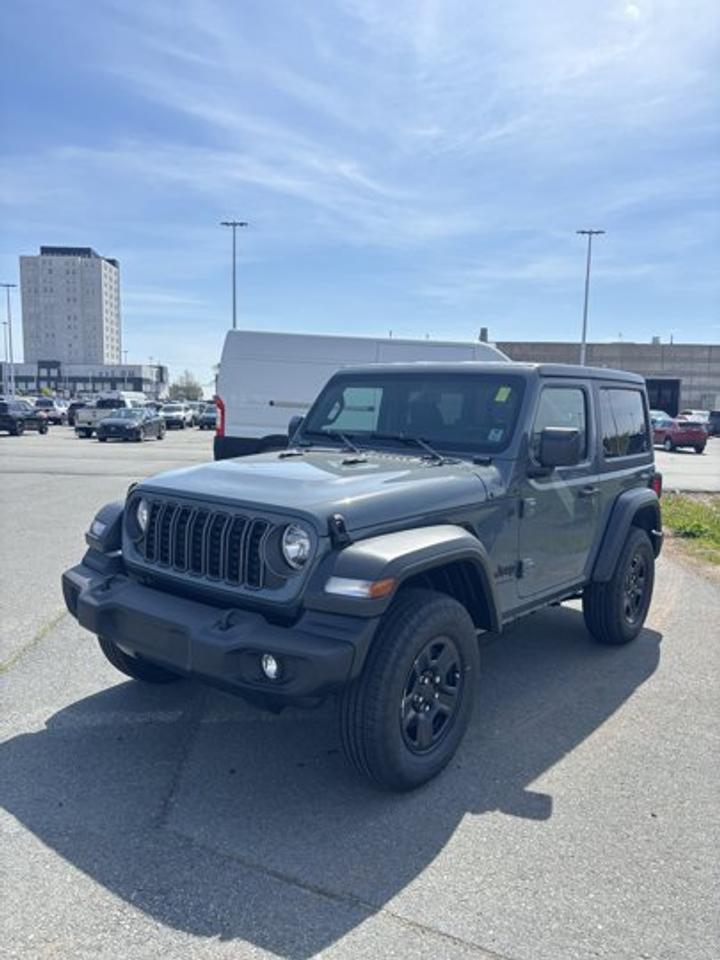 Brand new and ready for Halifax roads, the 2026 Jeep Wrangler Sport brings open-air freedom, true 4x4 capability, and classic Jeep character in a focused two-door design. Finished in dark blue with a black interior, this 2026 Jeep Wrangler Sport pairs a manual transmission with a proven 3.6-litre Pentastar V-6 gas engine.Built for drivers who want direct control and authentic adventure, this convertible keeps the Wrangler formula simple and capable. The 2026 Jeep Wrangler Sport is made for weekend trails, coastal drives, and daily use alike, with four-wheel drive and a rear window defroster adding welcome practicality in changing Maritime weather.FEATURES OF THE Wrangler SportClassic two-door convertible adventure designManual transmission for engaged driving feelFour-wheel drive for added tractionProven 3.6-litre Pentastar V-6 powerADVANCED SAFETY FEATURESFour-wheel drive supports slippery road tractionRear window defroster aids winter visibilityStrong body design for rugged useHigh driving position helps forward visibilityPERFORMANCE AND EFFICIENCY3.6-litre V-6 delivers proven powerManual gearbox gives direct driver controlFour-wheel drive boosts off-road confidenceGas engine suits long-distance travelCOMFORT AND CONVENIENCETwo-door layout feels sporty and practicalBlack interior offers durable everyday appealConvertible design welcomes open-air drivingRear window defroster helps cold morningsTECHNOLOGY AND CONNECTIVITYClear driver-focused controls support easy useManual setup keeps operation simpleEasy-to-read gauges aid quick checksPractical layout supports daily drivingCARGO SPACERear area handles daily gear needsTwo-door body keeps cargo access simpleFlexible space supports weekend packingCompact shape helps urban parking easeWHAT OTHER OWNERS LIKERemovable roof adds outdoor freedomStrong V-6 power feels dependableManual transmission increases driving engagementFour-wheel drive inspires trail confidenceThe dark blue exterior gives this new Wrangler a confident look that fits both city streets and rugged routes. Its compact two-door footprint is easy to place, while the convertible body delivers the pure Jeep experience many drivers want most.At Steele Halifax Chrysler Dodge Jeep Ram FIAT in Halifax, this 2026 Jeep Wrangler Sport stands out for its honest capability and timeless purpose. If you want a brand-new Jeep with a manual transmission, four-wheel drive, and the freedom of a convertible, this Wrangler is ready to get to work and head out for fun.This 2026 Jeep Wrangler Sports VIN is: 1C4PJXAG7TW306940.We invite you to book a viewing and test drive at your earliest convenience