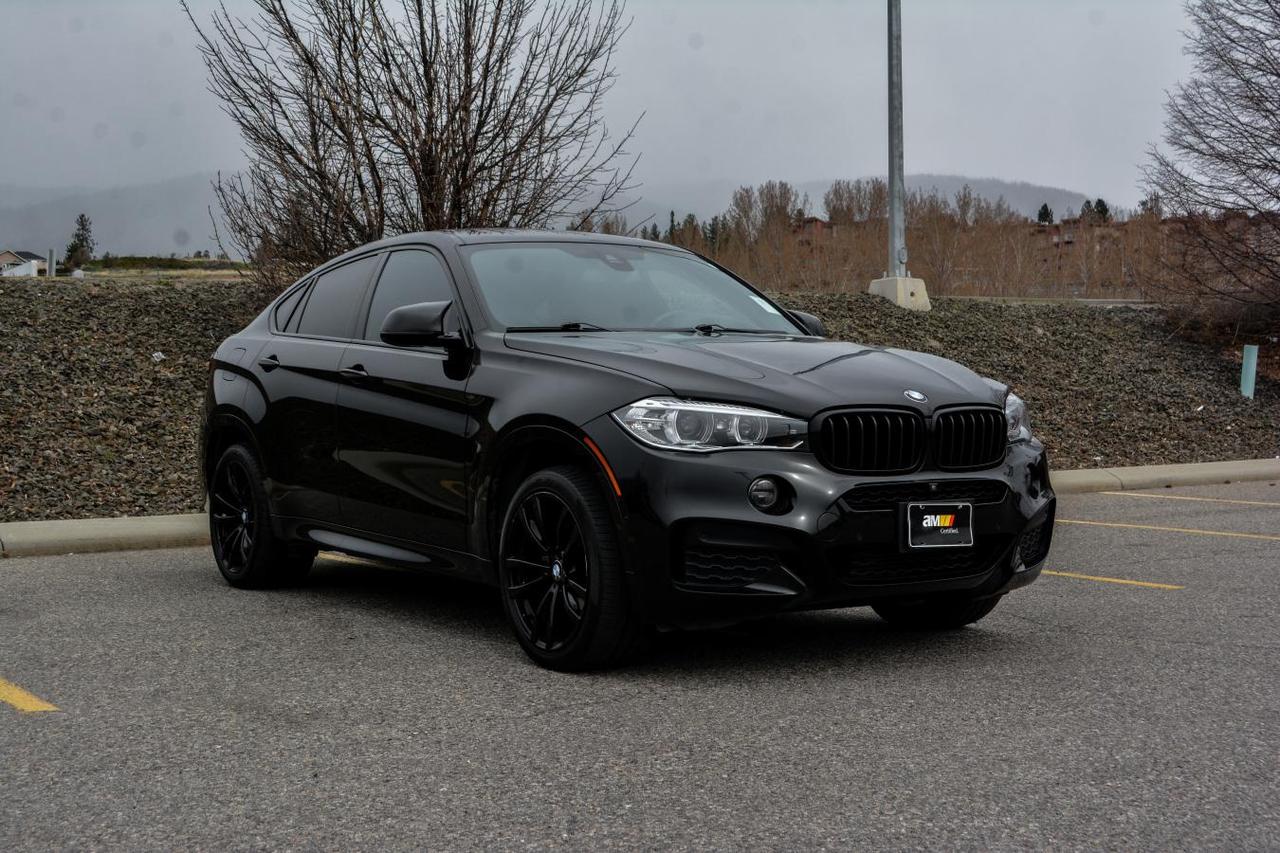 Lane Assist l Blind Spot Assist l Park Assist l Collison Avoidance l Sunroof l Ambient Lighting l Heated Seats l Heated Steering Wheel l Dual Zone Climate Control l Comfort Access l Navigation l Bluetooth Audio l Apple CarPlay l Harmon Kardon Audio l M Sport Package l Non Smoker l 2 Sets of Tires l LOW KM! 

Introducing this 2017 BMW X6 xDrive35i, a non-smoker and local BC vehicle with just 75,000 km. This X6 was recently traded into our dealership by a loyal customer upgrading to a newer BMW X5, and it presents an excellent opportunity to own a stylish and performance-oriented luxury SUV. Powered by a 3.0L TwinPower Turbo inline-6 engine paired with an 8-speed automatic transmission and BMWs intelligent xDrive all-wheel drive system, the X6 delivers smooth, responsive performance with confident handling in all driving conditions.

This X6 comes well equipped and is enhanced by the sought-after M Sport Package, adding an aggressive design and sport-focused features. Exterior highlights include the M Aerodynamics package, sport styling accents, and distinctive staggered M Sport Wheels, all finished in a sleek black exterior that pairs perfectly with its bold red interior. Comfort and convenience features include heated front and rear seats, a heated steering wheel, dual-zone climate control, Comfort Access keyless entry, power tailgate, and ambient interior lighting. Technology is centered around BMWs iDrive system with navigation, Bluetooth, Apple CarPlay and a premium Harman Kardon surround sound system. Safety and driver assistance features include a 360 camera, front and rear park assist and lane departure warning. 

This BMW X6 xDrive35i has undergone a comprehensive inspection and is Market Certified. Our technicians confirmed the vehicle is in excellent mechanical condition and completed a full synthetic oil and filter service, performed a four-wheel alignment, and addressed a common oil leak issue by replacing the oil pan gasket. It has also been finished with our professional detailing package and is ready for delivery.

Why purchase from AutoMarket? Every vehicle is certified by our expert technicians through our 75-point safety inspection, with all services completed using OEM or name-brand parts. Enjoy priority VIP servicing and lifetime washes*, all with a low-pressure, haggle-free experience.

*Please ask for complete details and eligibility.

Administrative fee may apply.