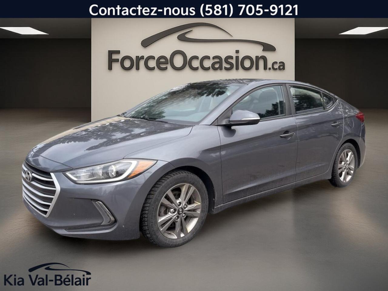jamais accidenté // Inspecté en 135 points

La Hyundai Elantra GL 2018 usagée proposée par Kia Val-Bélair à Québec mise sur une formule simple et bien équipée. Avec son moteur de 2,0 litres, sa transmission manuelle 6 vitesses, sa carrosserie grise à 4 portes et 96 562 km à lodomètre, ce véhicule offre une conduite directe et une dotation utile au quotidien.

CARACTÉRISTIQUES DU Elantra GL
»» Moteur 2,0 litres à 4 cylindres
»» Transmission manuelle 6 vitesses de série
»» Traction avant pour conduite prévisible
»» Caméra de recul incluse sur ce véhicule

CARACTÉRISTIQUES DE SÉCURITÉ AVANCÉES
»» Surveillance des angles morts intégrée
»» Caméra de recul pour manoeuvres arrière
»» Contrôle de stabilité avec système antiblocage
»» Coussins gonflables latéraux et rideaux latéraux

PERFORMANCE ET EFFICACITÉ
»» Moteur 2,0 litres à essence sans plomb
»» Transmission manuelle 6 vitesses incluse
»» Direction assistée pour manoeuvres plus faciles
»» Traction avant adaptée aux routes du Québec

CONFORT
»» Sièges avant chauffants pour lhiver
»» Climatisation avant pour température réglable
»» Volant réglable avec revêtement de cuir
»» Rétroviseurs chauffants et électriques pratiques

TECHNOLOGIE ET CONNECTIVITÉ
»» Intégration Bluetooth pour appels mains libres
»» Commandes audio intégrées directement au volant
»» Radio satellite incluse à bord
»» Phares automatiques pour usage quotidien

ESPACE DE CHARGEMENT
»» Coffre arrière avec accès pratique
»» Banquette et coffre faciles à utiliser
»» Ouverture à distance du coffre incluse
»» Pneu de secours pour imprévus routiers

RÉCOMPENSES ET RECONNAISSANCES
»» Meilleur choix sécurité, Insurance Institute for Highway Safety, 2018

APPRÉCIÉ DES AUTRES PROPRIÉTAIRES
»» Consommation raisonnable avec moteur 2,0 litres
»» Commandes simples et faciles à comprendre
»» Habitacle confortable pour trajets quotidiens
»» Conduite stable et tenue de route rassurante

GARANTIE
»» Garantie légale seulement
»» Garantie dusage
»» Garantie de durée raisonnable
»» Garantie contre les vices cachés

Cette Hyundai Elantra GL 2018 se distingue par son équipement bien ciblé, sans complexité inutile. On y retrouve des éléments recherchés comme la surveillance des angles morts, les sièges avant chauffants, les rétroviseurs chauffants, lintégration Bluetooth et la caméra de recul, dans un format pratique pour la ville comme pour la route.

Son habitacle noir, ses 4 portes et sa configuration manuelle conviendront à lacheteur qui veut garder le contrôle de la conduite tout en profitant dun véhicule moderne et fonctionnel. Le régulateur de vitesse, les vitres électriques, le dégivreur de vitre arrière et le verrouillage automatique des portes ajoutent des commodités utiles au quotidien.

Pour un conducteur qui cherche une berline compacte usagée avec des équipements concrets, une mécanique simple et un bon niveau de sécurité, ce véhicule représente une option logique. Son kilométrage de 96 562 km demeure cohérent pour lannée, et sa présentation grise lui donne une allure sobre et facile à apprécier.

Le NIV de ce Hyundai Elantra GL 2018 est le KMHD84LF7JU705644 .

Garantie prolongée disponible, livraison en 48h
