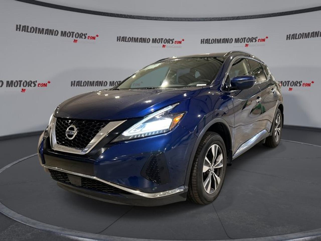 // ACCIDENT FREE!! //<br /><br />This 2019 Nissan Murano SV AWD | No Accidents | Heated Steering is a refined midsize SUV built for daily comfort and confident year-round travel. Offered by Haldimand Motors Ltd. in Cayuga, it pairs a smooth 3.5-litre gas engine with all-wheel drive and a CVT. The blue exterior and black interior give it a clean, upscale look.<br /><br />With 108,000 km, this used Nissan Murano shows the practical value drivers want in a family-ready SUV. Four doors, a roomy cabin, and a strong list of useful features make it easy to enjoy every trip. Heated front seats, a heated steering wheel, navigation, and a panoramic sunroof add comfort and convenience.<br /><br />FEATURES OF THE Murano SV AWD | No Accidents | Heated Steering<br /><br />   Heated steering wheel adds welcome winter comfort<br />   Panoramic sunroof brightens the roomy cabin<br />   Navigation system helps guide every trip<br />   All-wheel drive adds year-round road confidence<br /><br />ADVANCED SAFETY FEATURES<br /><br />   Backup camera helps with reversing visibility<br />   Blind spot monitor supports safer lane changes<br />   Anti-lock brakes help maintain steering control<br />   Stability control adds confidence on slippery roads<br /><br />PERFORMANCE AND EFFICIENCY<br /><br />   3.5-litre gas engine delivers smooth power<br />   Continuously variable transmission supports relaxed driving<br />   All-wheel drive improves traction in Canada<br />   Power steering gives easy urban handling<br /><br />COMFORT AND CONVENIENCE<br /><br />   Heated front seats help on cold mornings<br />   Dual-zone climate control keeps comfort balanced<br />   Remote starter helps prepare the cabin<br />   Power liftgate simplifies cargo area access<br /><br />TECHNONOLGY AND CONNECTIVITY<br /><br />   Apple CarPlay keeps apps within easy reach<br />   Android Auto adds simple phone integration<br />   Bluetooth integration supports hands-free communication<br />   Satellite radio expands in-cabin entertainment choices<br /><br />CARGO SPACE<br /><br />   Rear trunk access makes loading more convenient<br />   Power liftgate helps with busy errands<br />   Four-door layout supports daily family use<br />   Spacious design suits groceries and gear<br /><br />AWARDS & RECOGNITIONS<br /><br />   Top Safety Pick, Insurance Institute for Highway Safety, 2019<br /><br />WHAT OTHER OWNERS LIKE<br /><br />   Quiet ride makes highway travel more relaxing<br />   Comfortable seating helps on longer drives<br />   Smooth V6 power feels strong and refined<br />   Easy entry cargo area adds versatility<br /><br />This Murano is well equipped with practical features that matter every day. Cruise control, power windows, electric mirrors, heated mirrors, automatic headlights, tinted windows, a rear spoiler, and push button start all help create an easy and polished driving experience. Steering wheel audio controls and an adjustable steering wheel keep key functions close at hand.<br /><br />Inside, the cabin is designed to feel welcoming and functional. Front air conditioning, automatic climate control, drivers seat lumbar support, a power drivers seat, illuminated vanity mirrors, ambient lighting, and a leather steering wheel all help make commutes and road trips more enjoyable. The black interior gives this SUV a timeless and easy-to-maintain appearance.<br /><br />Technology is another strong point in this 2019 Nissan Murano SV AWD | No Accidents | Heated Steering. Along with navigation, Apple CarPlay, Android Auto, Bluetooth, HD Radio, and satellite radio, it also includes a clear backup camera for added confidence. These features help keep drivers informed, connected, and entertained without adding unnecessary complexity.<br /><br />Safety and peace of mind remain front and centre. This accident-free SUV includes driver and passenger airbags, side impact airbags, head side airbags, child safety locks, tire pressure monitoring, automatic door locks, turn signal mirrors, and a passenger airbag sensor. It is a smart choice for drivers who want comfort, traction, and useful technology in one well-rounded Nissan SUV.<br /><br />This 2019 Nissan Murano SV AWD | No Accidents | Heated Steerings VIN is: 5N1AZ2MS3KN155919.<br /><br />WHY CHOOSE US? <br /><br />Honest & Transparent Buying Experience: Weve been a trusted name in business since 1984.<br /><br />STRAIGHTFORWARD PRICING:<br />Our Advertised Price Includes:<br />>>Safety Certification (No separate fee!)<br />>>30-Day 100% Mechanical Warranty<br />>>FREE Carfax History Report.<br />>>No upcharge for paying cash.<br />(Prices Exclude HST and Licensing Fees only.)<br /><br />>>Browse 300+ vehicles all in ONE LOCATION<br /><br />EASY FINANCING: Great rates & open loans<br /><br />WE BUY CARS: Get Top Dollar for your trade-in, or sell us your vehicle for CASH! Even if you dont buy from us!<br /><br />STOP BY TODAY<br />Treat yourself - stop by Haldimand Motors Ltd. located at 42 Talbot St E, Cayuga, ON N0A 1E0 to make this car yours today!<br /><br />https://www.haldimandmotors.com/used/stock-460741.html