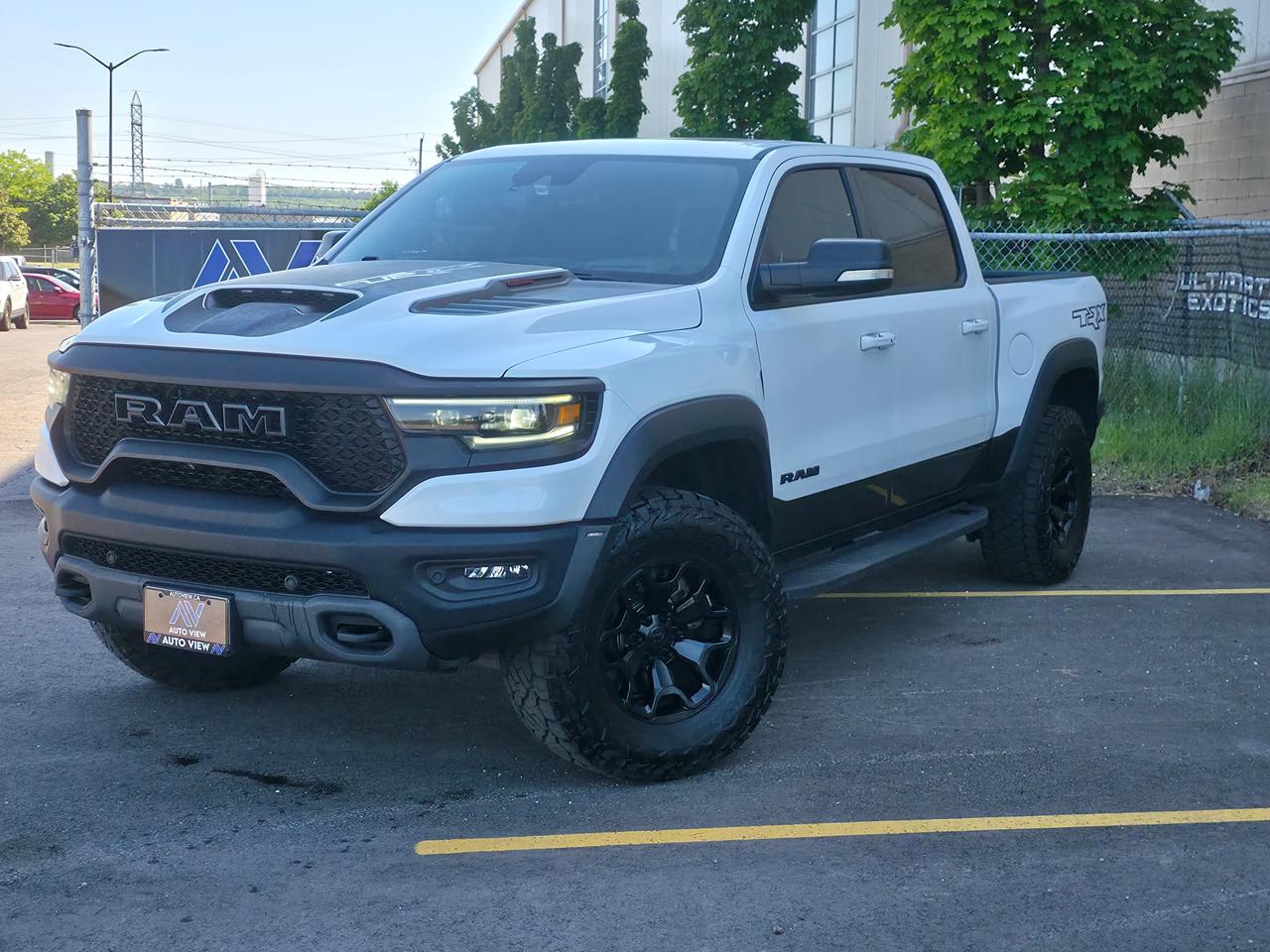 <p dir=ltr>JUST ARRIVED!!</p><p dir=ltr>2021 RAM 1500 TRX</p><p dir=ltr>EXCELLENT PERFORMANCE PICKUP TRUCK!!</p><p dir=ltr>The 2021 Ram 1500 TRX is a high-performance, wide-body pickup truck powered by a 6.2-litre supercharged HEMI&reg; V8 Hellcat engine. This ultimate off-road predator produces an astonishing 702 horsepower and 650 lb-ft of torque. It was specifically engineered by Ram to dominate high-speed desert trails while maintaining premium on-road luxury.</p><p dir=ltr><strong>Key Performance Specifications:</strong></p><p dir=ltr><strong>Acceleration:</strong> 0 to 100 kph in 4.5 seconds (tested as low as 3.7 seconds by automotive news outlets).</p><p dir=ltr><strong>Quarter Mile:</strong> Clocks in at 12.9 seconds at the track.</p><p dir=ltr><strong>Top Speed:</strong> Electronically limited to 190 kph due to its specialized off-road tires.</p><p dir=ltr><strong>Towing & Payload:</strong> Max towing capacity of 8,100 lbs and a payload capacity of 1,310 lbs.</p><p dir=ltr><strong>Fuel Economy:</strong> EPA-rated at a thirsty 23.5 city / 16.8 highway L/100km</p><p dir=ltr><strong>Engine:</strong> 6.2L Supercharged Hellcat V8</p><p dir=ltr><strong>Horsepower:</strong> 702 hp</p><p dir=ltr><strong>Torque:</strong> 650 lb-ft</p><p dir=ltr><strong>Transmission:</strong> ZF 8HP95 8-speed automatic</p><p dir=ltr><strong>Off-Road Capabilities:</strong></p><p dir=ltr><strong>Massive Stance:</strong> Built 8 inches wider with a 6-inch wider track than a standard Ram 1500.</p><p dir=ltr><strong>Bilstein Dampers:</strong> Equipped with Bilstein Black Hawk e2 adaptive shocks providing over 13 inches of suspension travel.</p><p dir=ltr><strong>Ground Clearance:</strong> Sits on 35-inch Goodyear Wrangler Territory All-Terrain tires, providing 11.8 inches of clearance.</p><p dir=ltr><strong>Drive Modes:</strong> Features 8 performance modes including Baja, Sport, Rock, Mud/Sand, and Snow, alongside a dedicated Launch Control system.</p><p dir=ltr><strong>Intake System:</strong> Uses a functional dual-path hood scoop and grille that filters out heavy dust and sand</p><p dir=ltr><strong>Interior & Technology:</strong></p><p dir=ltr><strong>Seating:</strong> Premium materials including leather and Alcantara suede, with available heated and ventilated front/rear seats.</p><p dir=ltr><strong>Infotainment:</strong> A massive vertically oriented 12-inch touchscreen with performance, dyno, and off-road monitoring pages.</p><p dir=ltr><strong>Audio:</strong> Available 19-speaker Harman Kardon premium sound system.</p><p dir=ltr style=line-height: 1.2; margin-top: 12pt; margin-bottom: 12pt;>&nbsp;</p><p dir=ltr style=line-height: 1.2; margin-top: 12pt; margin-bottom: 12pt;><span style=font-size: 11pt; font-family: Roboto,sans-serif; color: #000000; background-color: transparent; font-weight: 400; font-style: italic; font-variant: normal; text-decoration: none; vertical-align: baseline; white-space: pre-wrap;>**VEHICLE BEING SOLD ON CONSIGNMENT** </span></p><p dir=ltr style=line-height: 1.2; margin-top: 12pt; margin-bottom: 12pt;><span style=font-size: 11pt; font-family: Roboto,sans-serif; color: #000000; background-color: transparent; font-weight: 400; font-style: italic; font-variant: normal; text-decoration: none; vertical-align: baseline; white-space: pre-wrap;>FINANCING AND LEASING AVAILABLE ON ALL CERTIFIED VEHICLES.</span></p><p dir=ltr style=line-height: 1.2; margin-top: 12pt; margin-bottom: 12pt;><span style=font-size: 11pt; font-family: Roboto,sans-serif; color: #000000; background-color: transparent; font-weight: 400; font-style: italic; font-variant: normal; text-decoration: none; vertical-align: baseline; white-space: pre-wrap;>HST and Licensing Fees are to be charged on all vehicles.&nbsp;</span></p><p dir=ltr style=line-height: 1.2; margin-top: 12pt; margin-bottom: 12pt;><span style=font-size: 11pt; font-family: Roboto,sans-serif; color: #000000; background-color: transparent; font-weight: 400; font-style: italic; font-variant: normal; text-decoration: none; vertical-align: baseline; white-space: pre-wrap;>All CERTIFIED vehicles come with a 36-day Safety Guarantee.</span></p><p dir=ltr style=line-height: 1.2; margin-top: 12pt; margin-bottom: 12pt;><span style=font-size: 11pt; font-family: Roboto,sans-serif; color: #000000; background-color: transparent; font-weight: 400; font-style: italic; font-variant: normal; text-decoration: none; vertical-align: baseline; white-space: pre-wrap;>ALL CERTIFIED VEHICLES COME WITH A BRONZE GLOBAL WARRANTY (3 MONTH / 3,000 KM / $1,000 PER CLAIM)</span></p><p dir=ltr style=line-height: 1.2; margin-top: 12pt; margin-bottom: 12pt;><span style=font-size: 11pt; font-family: Roboto,sans-serif; color: #000000; background-color: transparent; font-weight: 400; font-style: italic; font-variant: normal; text-decoration: none; vertical-align: baseline; white-space: pre-wrap;>EXTENDED GLOBAL WARRANTY OPTIONS AVAILABLE ON ALL CERTIFIED VEHICLES.</span></p><p dir=ltr style=line-height: 1.2; margin-top: 12pt; margin-bottom: 12pt;><span style=font-size: 11pt; font-family: Roboto,sans-serif; color: #000000; background-color: transparent; font-weight: 400; font-style: italic; font-variant: normal; text-decoration: none; vertical-align: baseline; white-space: pre-wrap;>Auto View is located at 590 South Service Road Stoney Creek, only minutes off the QEW Exit 83 Fruitland Road!</span></p><p dir=ltr style=line-height: 1.2; margin-top: 12pt; margin-bottom: 12pt;><span style=font-size: 11pt; font-family: Roboto,sans-serif; color: #000000; background-color: transparent; font-weight: 400; font-style: italic; font-variant: normal; text-decoration: none; vertical-align: baseline; white-space: pre-wrap;>Contact us VIA email, call, or text!</span></p><p dir=ltr style=line-height: 1.2; margin-top: 12pt; margin-bottom: 12pt;><span style=font-size: 11pt; font-family: Roboto,sans-serif; color: #000000; background-color: transparent; font-weight: 400; font-style: italic; font-variant: normal; text-decoration: none; vertical-align: baseline; white-space: pre-wrap;>sales@autoview.ca</span></p><p style=line-height: 1.2;><span id=docs-internal-guid-dc6619b1-7fff-14fb-1847-6df547af7f68></span></p><p dir=ltr style=line-height: 1.2; margin-top: 12pt; margin-bottom: 12pt;><span style=font-size: 11pt; font-family: Roboto,sans-serif; color: #000000; background-color: transparent; font-weight: 400; font-style: italic; font-variant: normal; text-decoration: none; vertical-align: baseline; white-space: pre-wrap;>905-379-4206</span></p>