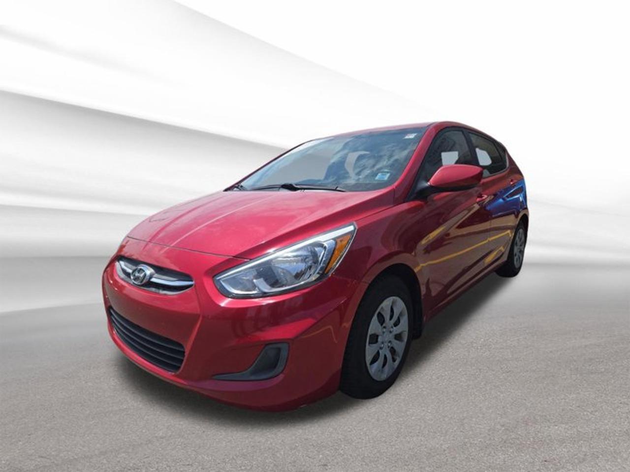 Meet a practical and efficient hatchback built for daily life in Halifax. This used 2016 Hyundai Accent GL offers simple value, a fuel-friendly 1.6-litre 4-cylinder engine, and a manual transmission that gives you direct control on every drive. Finished in red with a black interior, this front-wheel drive Accent GL is a smart choice for drivers who want dependable transportation with hatchback versatility.With 135,347 km on the odometer, this 2016 Hyundai Accent GL continues to stand out for its easy manoeuvrability, compact size, and useful 4-door layout. Its hatchback design adds flexibility for groceries, gear, and everyday errands, while the manual gearbox brings an engaging feel that many drivers still appreciate. For city streets, commuting, and weekend trips, this Hyundai delivers honest capability and strong overall value.FEATURES OF THE Accent GL1.6-litre four-cylinder gas engineManual transmission for direct controlFront-wheel drive for daily confidenceFour-door hatchback body styleADVANCED SAFETY FEATURESFront and side impact airbagsElectronic stability control for added confidenceAnti-lock braking system helps controlActive front head restraints includedPERFORMANCE AND EFFICIENCYEfficient 1.6-litre four-cylinder engineManual transmission adds driver engagementFront-wheel drive supports year-round usabilityCompact size helps save fuelCOMFORT AND CONVENIENCEFour doors improve passenger accessHatchback design adds everyday versatilityCompact footprint eases urban parkingClear cabin layout feels user-friendlyTECHNOLOGY AND CONNECTIVITYSimple controls are easy to useDriver information display is straightforwardAudio system supports daily commutingConvenient layout reduces driver distractionCARGO SPACEHatchback opening allows easy loadingRear cargo area suits errandsFlexible space for daily itemsPractical design supports active lifestylesAWARDS & RECOGNITIONSTop Safety Pick, Insurance Institute for Highway Safety, 2016WHAT OTHER OWNERS LIKEGreat fuel economy for commutingEasy to park in townManual transmission feels more engagingHatchback utility for everyday useThe 2016 Hyundai Accent GL is well suited to drivers who want affordable ownership and practical design without unnecessary complexity. Its compact dimensions make it easy to handle in traffic and simple to park in tighter spaces around Halifax. At the same time, the hatchback body gives you more usable cargo flexibility than a traditional small sedan.This model is also known for straightforward operation and low-cost daily driving. The red exterior adds welcome character, while the black interior keeps the cabin looking clean and timeless. If you want a used hatchback that focuses on efficiency, function, and proven Hyundai value, this 2016 Hyundai Accent GL deserves a closer look at Steele Halifax Chrysler Dodge Jeep Ram FIAT.This 2016 Hyundai Accent GLs VIN is: KMHCT5AE2GU291756.We invite you to book a viewing and test drive at your earliest convenience