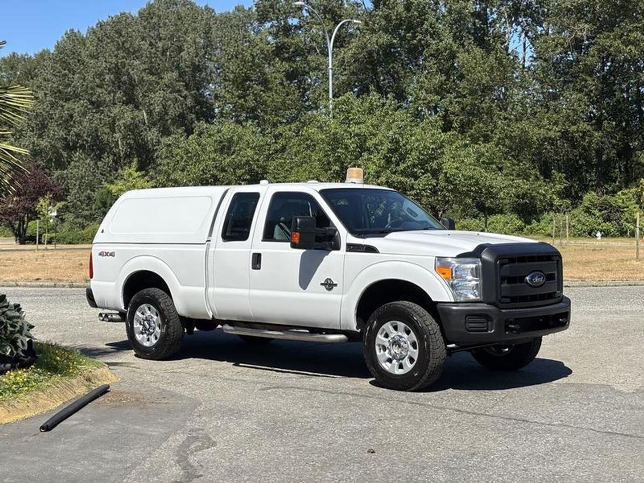This 2014 Ford F-250 Super Duty XL Extended Cab is powered by a 6.7L Power Stroke V8 turbo diesel engine paired with an automatic transmission and four-wheel drive. Built for towing, hauling, and commercial applications, this heavy-duty pickup offers diesel performance and practical utility in a versatile extended cab configuration.

Equipped with a canopy featuring a slide-out cargo tray, this truck provides secure and accessible storage for tools, equipment, and materials. Additional features include a trailer hitch receiver, integrated trailer brake controller, electronic locking differential, heated mirrors, power windows, power door locks, power mirrors, air conditioning, AM/FM radio, and a CD player.

Finished in white with a gray cloth interior, this F-250 Super Duty offers a capable platform suitable for contractors, fleet operators, tradespeople, and recreational towing applications. This item is currently OFFSITE. You must register an appointment with our office to schedule an offsite viewing. Appointments must be made a minimum of one business day in advance (and as defined by the days that Repo.com is open for business) before your appointment can be scheduled and confirmed. We may, at our own discretion, instead opt to transport smaller items to Repo.coms main yard for viewing purposes.  $29,810.00 plus $375 processing fee, $30,185.00 total payment obligation before taxes.   Listing report, warranty, contract commitment cancellation fee, financing available on approved credit (some limitations and exceptions may apply). All above specifications and information is considered to be accurate but is not guaranteed and no opinion or advice is given as to whether this item should be purchased. We do not allow test drives due to theft, fraud, acts of vandalism and undetectable impaired driving. Instead we provide the following benefits: Complimentary Warranty (with options to extend), Limited Money Back Satisfaction Guarantee on Fully Completed Contracts, Contract Commitment Cancellation, and an Open-Ended Sell-Back Option. Ask seller for details or call 604-522-REPO(7376) to confirm listing availability.
