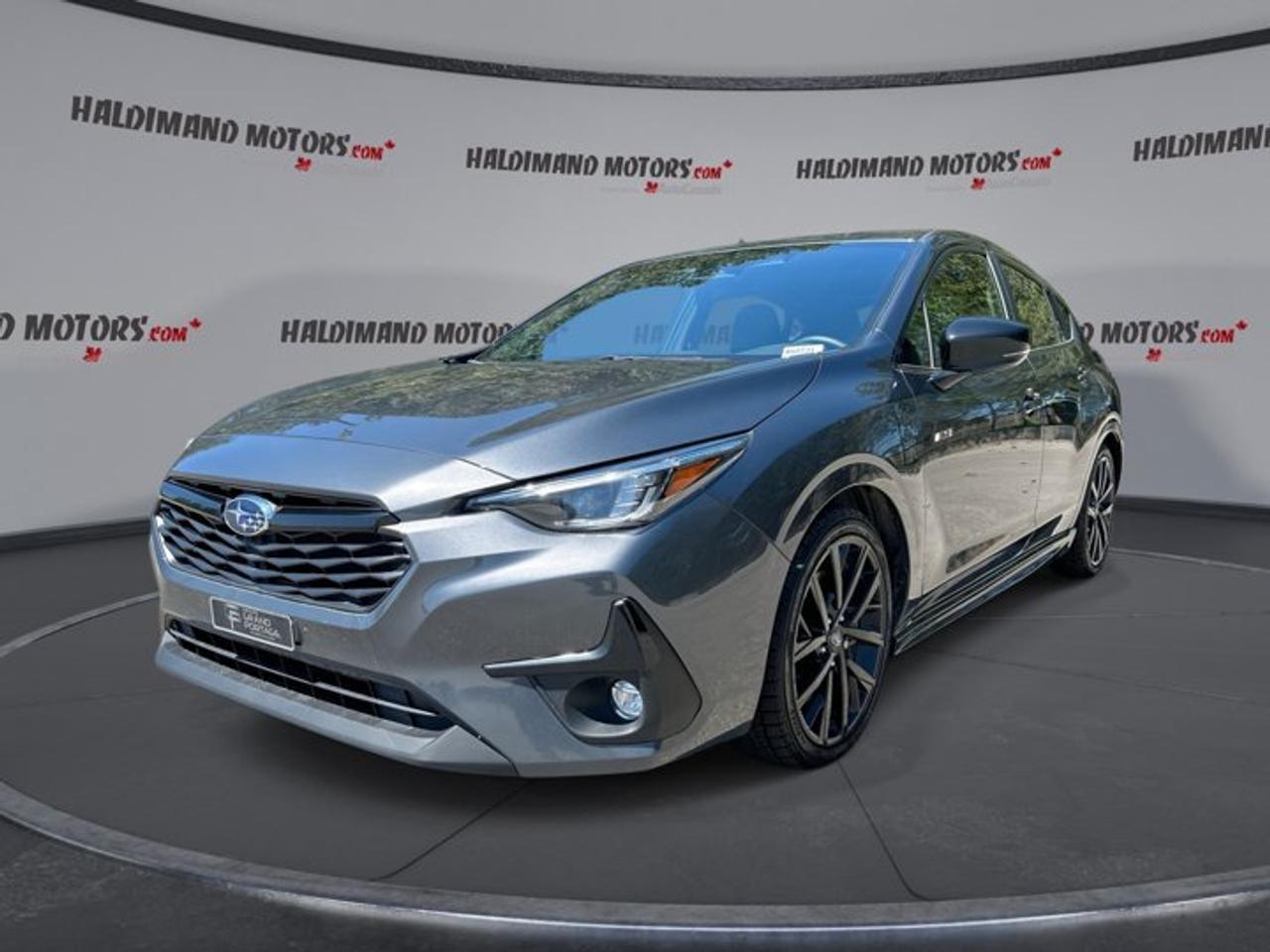 // ACCIDENT FREE!! //<br />// SINGLE OWNER! //<br /><br />This 2025 Subaru Impreza RS AWD is a smart choice for drivers who want year-round confidence, useful comfort, and lively performance in one compact package. Offered by Haldimand Motors Ltd. in Cayuga, this grey sedan has had one owner, has no accident history, and shows 23,001 km.<br /><br />Finished in grey with a black interior, this 2025 Subaru Impreza RS AWD brings a clean, sporty look with four doors, a rear spoiler, fog lights, and LED headlamps. Its practical size makes city driving easy, while standard all-wheel drive helps it stay composed through changing Ontario road conditions.<br /><br />Power comes from a 2.5-litre gas engine paired with a CVT and dual shift mode transmission. This setup gives the 2025 Subaru Impreza RS AWD smooth response in traffic and steady power on the highway. It is a great fit for commuters, students, and families who value confidence and everyday ease.<br /><br />FEATURES OF THE Impreza RS AWD | One Owner | No Accidents | Sunroof | Heated Steering<br />   2.5-litre engine with standard all-wheel drive<br />   Power sunroof adds light and fresh air<br />   Heated steering wheel for cold mornings<br />   Blind spot monitor adds daily confidence<br /><br />ADVANCED SAFETY FEATURES<br />   Backup camera helps with reversing visibility<br />   Lane departure warning supports attentive driving<br />   Blind spot monitor aids lane changes<br />   Side and head airbags enhance protection<br /><br />The 2025 Subaru Impreza RS AWD is well equipped for peace of mind on busy roads. Anti-lock brakes, stability control, child safety locks, adaptive cruise control, and automatic door locks all add to its secure and easy-to-drive nature. This sedan is built to help drivers feel calm and in control.<br /><br />PERFORMANCE AND EFFICIENCY<br />   2.5-litre engine delivers responsive everyday power<br />   CVT supports smooth and efficient driving<br />   All-wheel drive boosts year-round traction<br />   Dual shift mode adds driver control<br /><br />With power steering and performance tires, the 2025 Subaru Impreza RS AWD feels balanced and composed in many driving situations. It is easy to place in tight spaces, yet stable on longer trips. The all-wheel-drive layout is a major benefit when roads are wet, snowy, or uneven.<br /><br />COMFORT AND CONVENIENCE<br />   Heated front seats warm cold commutes<br />   Heated steering wheel adds winter comfort<br />   Dual-zone climate control manages cabin temperatures<br />   Power driver seat includes lumbar support<br /><br />Inside, the 2025 Subaru Impreza RS AWD offers a cabin designed for daily comfort. Front air conditioning, automatic climate control, push button start, power windows, heated mirrors, electric mirrors, and an adjustable steering wheel all help make each drive simple and pleasant. The sunroof adds extra openness above.<br /><br />TECHNONOLGY AND CONNECTIVITY<br />   Apple CarPlay keeps apps within reach<br />   Android Auto connects your favourite features<br />   Bluetooth integration supports hands-free communication<br />   Steering wheel audio controls simplify use<br /><br />Technology in the 2025 Subaru Impreza RS AWD is easy to use and ready for modern life. Satellite radio, HD Radio, and automatic headlights add convenience, while the illuminated driver and passenger vanity mirrors show thoughtful cabin detail. This sedan keeps drivers connected without making the experience complicated.<br /><br />CARGO SPACE<br />   Rear trunk access makes loading easier<br />   Cargo cover helps conceal stored items<br />   Four-door design improves daily practicality<br />   Trunk suits groceries and travel gear<br /><br />The 2025 Subaru Impreza RS AWD makes everyday errands simple. Its trunk is well suited for shopping bags, backpacks, sports gear, and weekend luggage. The wide-opening rear access helps when loading larger items, giving this compact sedan useful versatility for many types of drivers.<br /><br />WHAT OTHER OWNERS LIKE<br />   Confident all-wheel drive in bad weather<br />   Easy-to-use infotainment and phone connectivity<br />   Comfortable ride for daily commuting<br />   Strong value with useful safety features<br /><br />This 2025 Subaru Impreza RS AWD | One Owner | No Accidents | Sunroof | Heated Steerings VIN is: JF1GUHJC1S8201667 .<br /><br />WHY CHOOSE US? <br /><br />Honest & Transparent Buying Experience: Weve been a trusted name in business since 1984.<br /><br />STRAIGHTFORWARD PRICING:<br />Our Advertised Price Includes:<br />>>Safety Certification (No separate fee!)<br />>>30-Day 100% Mechanical Warranty<br />>>FREE Carfax History Report.<br />>>No upcharge for paying cash.<br />(Prices Exclude HST and Licensing Fees only.)<br /><br />>>Browse 300+ vehicles all in ONE LOCATION<br /><br />EASY FINANCING: Great rates & open loans<br /><br />WE BUY CARS: Get Top Dollar for your trade-in, or sell us your vehicle for CASH! Even if you dont buy from us!<br /><br />STOP BY TODAY<br />Treat yourself - stop by Haldimand Motors Ltd. located at 42 Talbot St E, Cayuga, ON N0A 1E0 to make this car yours today!<br /><br />https://www.haldimandmotors.com/used/stock-460731.html