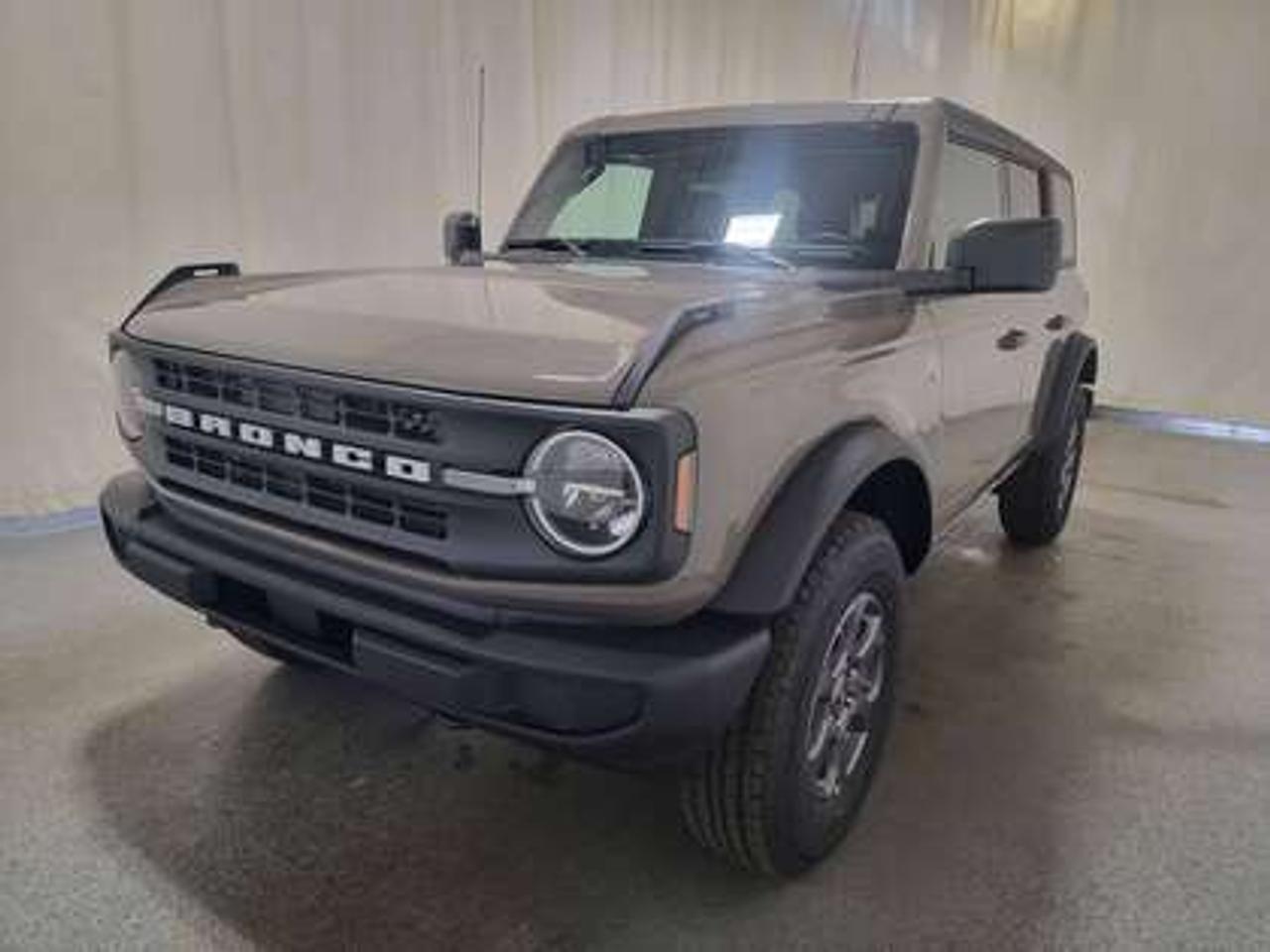 The 2026 Ford Bronco Big Bend looks absolutely stunning in Marsh Grey. Sporting an aggressive stance and a rugged, yet refined design, this full-sized 5-passenger SUV is powered by a 2.3L EcoBoost® engine producing 300 horsepower and 325 lb-ft of torque. Paired with a 10-speed automatic transmission, the Bronco Big Bend delivers smooth power delivery and engaging driving experience, whether youre navigating city streets or tackling off-road trails. With fuel mileage rated at 12.0L/100 km (24 Mile Per Gallon) combined highway/city.

Key Features:
4X4
BLIS® (Blind Spot Information System) with Cross-Traffic Alert
Lane-Keeping System
Pre-Collision Assist with Emergency Braking
Rear View Camera with Backup Assist Grid Lines
Remote Keyless Entry with Push-Button Start
Removable Doors & Roof 
Wireless Apple CarPlay® and Android Auto
17 All-Terrain Tires & Carbonized Grey Aluminum Wheels
Dual-Zone Electronic Automatic Temperature Control with Air Conditioning
Front Heated Seats
FordPass Connect with Remote Start
SYNC® 4 with 12 Touchscreen
Terrain Management System with G.O.A.T. Modes 
Engine Block Heater
Sound Deadening Headliner

This vehicle comes with the All-Weather Packageready to take on any season!
Snow, rain, mud, or sunshinethis vehicle is built for it all! The All-Weather Package adds extra protection where it matters most, with premium mud flaps to shield your paint from road debris, all-weather floor mats to protect your interior from lifes messes, and Xpel paint protection to help guard against those infuriating rock chips. Drive with confidence, knowing your investment is protected from Regina's elements.

Bennett Dunlop Ford, proudly serving Regina for over 40 years, is conveniently located at 770 Broad Street. With over 3,500 Google reviews, our reputation reflects our commitment to providing a fast, easy, and enjoyable vehicle-buying experience. We eliminate the hassle with no admin or documentation fees, transparent upfront pricing that lets you shop with total confidence. But were more than just a dealershipwere driven to make a difference by supporting local community initiatives and events that matter to you. Visit Bennett Dunlop Ford today and experience why were Reginas trusted choice for quality vehicles, exceptional service, and a genuine commitment to driving change in our community!