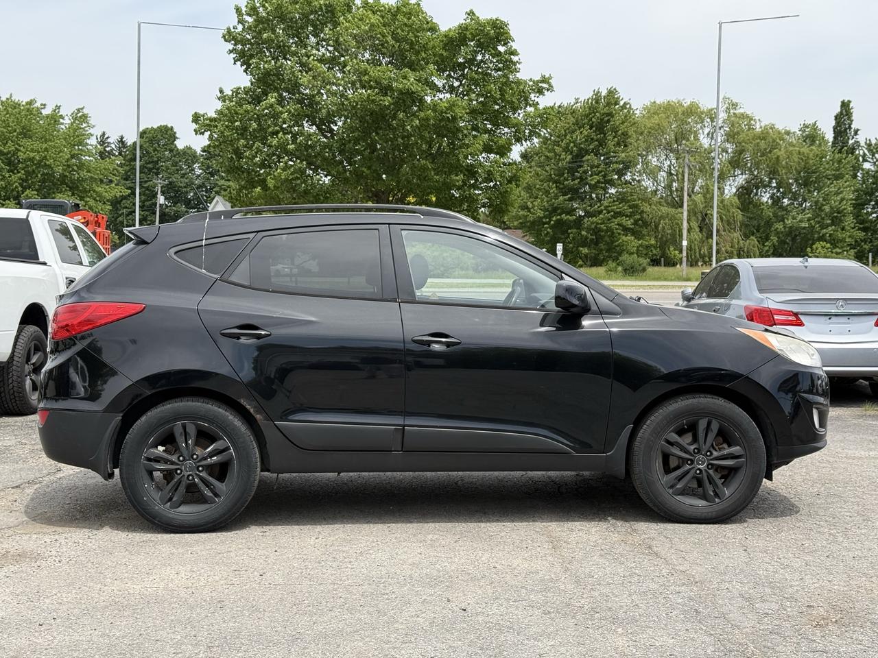 2011 Hyundai Tucson AWD 4dr I4 Auto GLS Photo