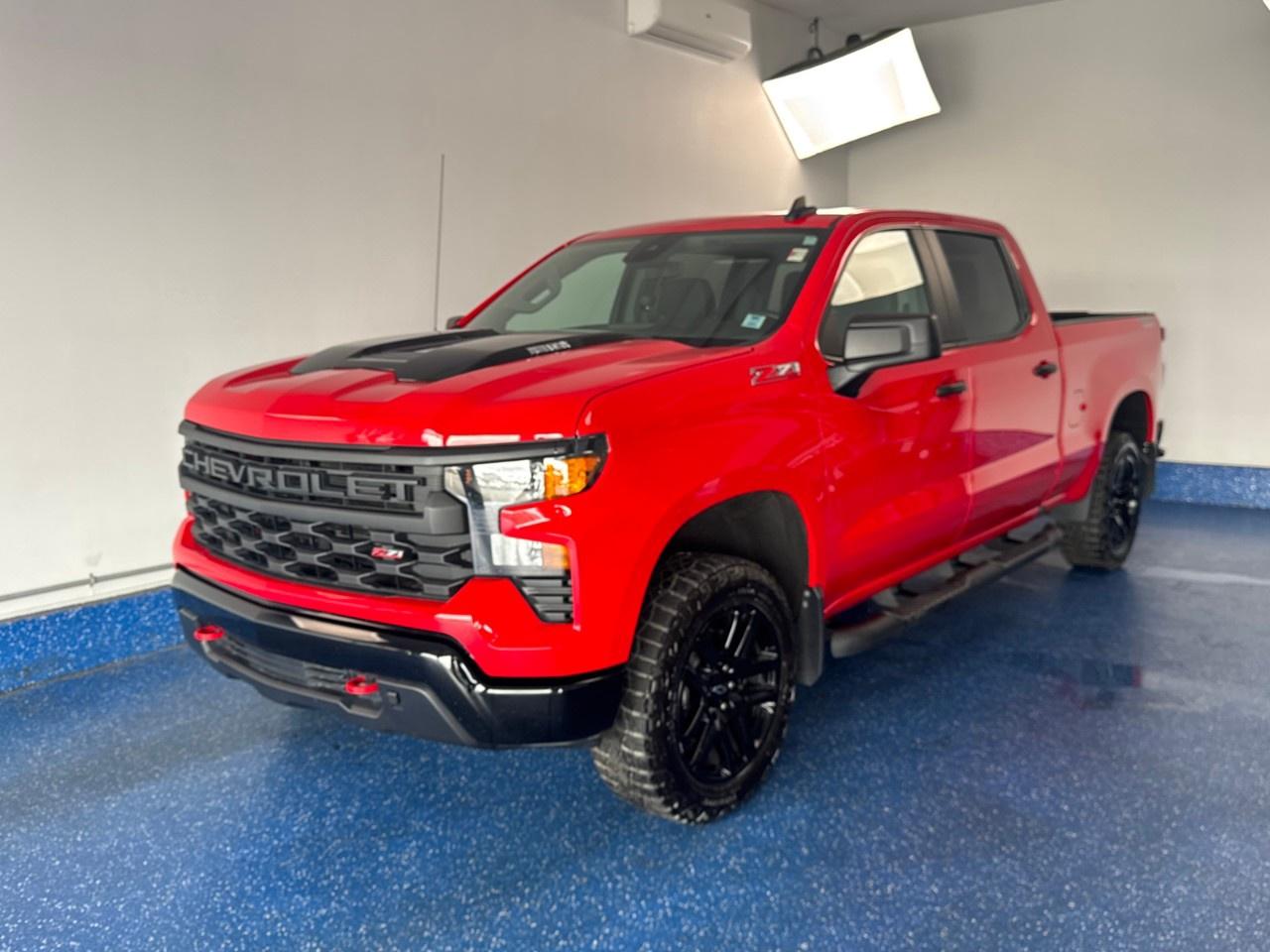 New Price! 2025 Chevrolet Silverado 1500 Custom Trail Boss Crew Cab Trail Boss | Duramax power | Low Kms | Za Certified. 10-Speed Automatic 4WD Radiant Red Tintcoat 3.0L I6<br /><br /><br />10-Speed Automatic, 4WD, Jet Black w/Cloth Seat Trim, 10-Way Power Driver Seat w/Lumbar, 120-Volt Bed Mounted Power Outlet, 120-Volt Interior Power Outlet, 3.5''' Monochromatic Display Driver Info Centre, 4''' Black Round Assist Steps (LPO), 40/20/40 Front Split-Bench Seat, 6-Speaker Audio System, Air Conditioning, Alloy wheels, Apple CarPlay/Android Auto, Auto-Locking Rear Differential, Black Name Plates (LPO), Black Tailgate CHEVROLET Lettering (LPO), Bluetooth® For Phone, Chevytec Spray-On Black Bedliner, Colour-Keyed Carpeting Floor Covering, Custom Convenience Package, Dark Essentials Package (LPO), Deep-Tinted Glass, Dual Rear USB Ports (Charge Only), Electric Rear-Window Defogger, Electrical Steering Column Lock, Electronic Cruise Control, EZ Lift Power Lock & Release Tailgate, Forward Collision Alert, Front Rubberized Vinyl Floor Mats, Fully automatic headlights, HD Rear Vision Camera, Heated door mirrors, Heavy-Duty Air Filter, Hill Descent Control, Hitch Guidance, Lane Keep Assist w/Lane Departure Warning, LED Cargo Area Lighting, Manual Tilt Wheel Steering Column, OnStar Services Capable, Performance Red Recovery Hooks, Power driver seat, Power Front Windows w/Driver Express Up/Down, Power Front Windows w/Passenger Express Down, Power Rear Windows w/Express Down, Power windows, Preferred Equipment Group 2CX, Premium audio system: Chevrolet Infotainment 3, Rear 60/40 Folding Bench Seat (Folds Up), Rear Rubberized-Vinyl Floor Mats, Rear window defroster, Remote Keyless Entry, Remote keyless entry, Remote Vehicle Starter System, SiriusXM Trial Subscription, Standard Tailgate, Suspension Package, Teen Driver, Theft Deterrent System (Unauthorized Entry), Tilt steering wheel, Tire Pressure Monitoring System, Trailering Package, Wheels: 20''' x 9''' High Gloss Black Painted Alum, Wi-Fi Hot Spot Capable.<br /><br />Certification Program Details: Fresh 2 Yr MVI | 30 day warranty* | 110 point inspection | Full tank of fuel | Krown rustproofed | Flexible financing options | Professionally detailed<br /><br />This vehicle is Zacks Certified! You're approved! We work with you. Together we'll find a solution that makes sense for your individual situation. Please visit us or call 902 843-3900 to learn about our great selection.<br /><br />With 22 lenders available Zack's Auto Sales can offer our customers with the lowest available interest rate. Thank you for taking the time to check out our selection!