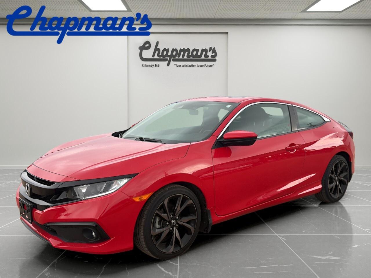 Meet a sporty and smart compact built for daily life in Killarney. This used 2019 Honda Civic Coupe Sport CVT Coupe blends sleek two-door style with trusted Honda engineering. Its red exterior adds energy, while the 2.0 L engine, automatic transmission, and front-wheel drive help make every trip smooth and easy.

With 85,174 km on the odometer, this 2019 Honda Civic Coupe Sport CVT Coupe still offers the balance of comfort, efficiency, and driver confidence that made the Civic a favourite across Canada. At Chapman Chevrolet Buick GMC, this coupe stands out for shoppers who want practical features with a fun design.

FEATURES OF THE Civic Coupe Sport Cvt Coupe

»» Sport styling with bold coupe profile
»» 2.0 L engine with CVT smoothness
»» Sunroof adds open-air driving enjoyment
»» Alloy wheels enhance look and stance

ADVANCED SAFETY FEATURES

»» Backup camera helps with tight parking
»» Front airbags support occupant protection
»» Traction control aids grip on roads
»» Stability support helps steady handling

PERFORMANCE AND EFFICIENCY

»» 2.0 L engine delivers balanced power
»» Automatic CVT supports smooth acceleration
»» Front-wheel drive suits Canadian driving
»» Efficient design helps lower fuel use

COMFORT AND CONVENIENCE

»» Heated seats add cold-weather comfort
»» Front air conditioning keeps cabin cool
»» Cruise control supports relaxed highway travel
»» Power windows add everyday ease

TECHNOLOGY AND CONNECTIVITY

»» Bluetooth integration supports hands-free calling
»» Smart device integration adds phone access
»» Keyless entry simplifies daily use
»» Clear controls are easy to reach

CARGO SPACE

»» Rear trunk handles daily cargo needs
»» Coupe layout supports grocery runs
»» Split storage suits smaller travel items
»» Cabin offers useful personal item space

AWARDS & RECOGNITIONS

»» Best Buy Compact Car, The Car Guide, 2019
»» Top Safety Pick, Insurance Institute for Highway Safety, 2019

WHAT OTHER OWNERS LIKE

»» Smooth ride for daily commuting
»» Strong fuel economy in regular driving
»» Easy-to-use controls and cabin layout
»» Sporty styling with dependable performance

This used 2019 Honda Civic Coupe Sport CVT Coupe is a great fit for drivers who want sharp looks, trusted reliability, and useful features without extra fuss. The sunroof brings more light into the cabin, while heated seats, cruise control, and remote starter help make every season easier to manage.

Bluetooth integration and smart device integration help keep you connected on the go. Alloy wheels complete the sporty appearance, and the backup camera adds welcome confidence when reversing. With two doors, a smart feature set, and proven Civic value, this coupe is ready for work, school, or weekend drives around Manitoba.

Find this used 2019 Honda Civic Coupe Sport CVT Coupe today at Chapman Chevrolet Buick GMC in Killarney and enjoy a compact car that delivers style, comfort, and everyday practicality in one well-rounded package.

This 2019 Honda Civic Coupe Sport Cvt Coupes VIN is: 2HGFC4B8XKH401406 .