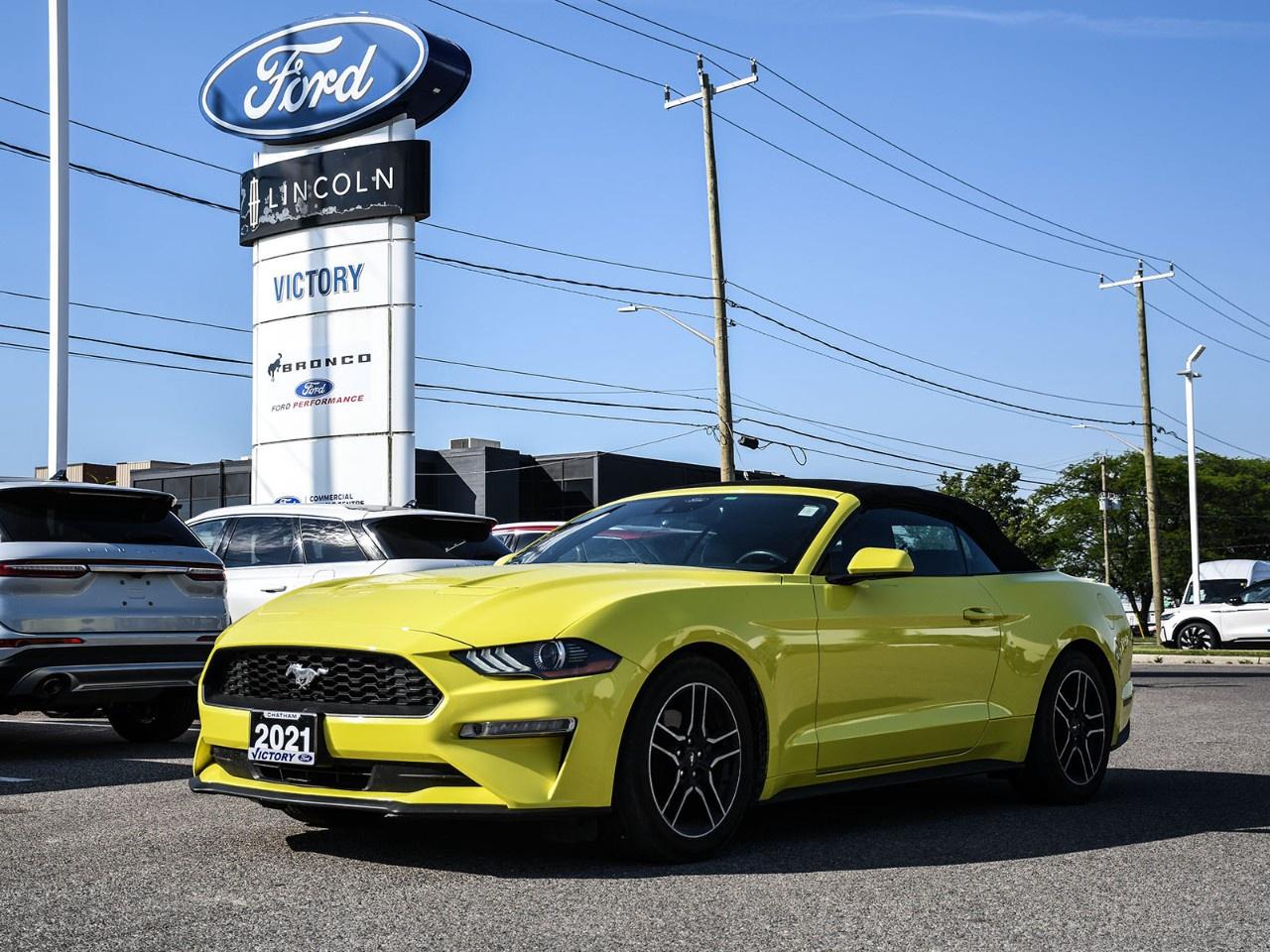 <h2>NOW AVAILABLE AT VICTORY FORD LINCOLN</h2><h1>2021 Ford Mustang EcoBoost® Premium Convertible</h1><h3>Active Valve Performance Exhaust  Ford Safe & Smart Package  Carbon Sport Interior Package  Open-Air Performance</h3><p>This 2021 Ford Mustang EcoBoost® Premium Convertible delivers thrilling performance, premium comfort, and unmistakable Mustang styling. Equipped with the Active Valve Performance Exhaust, Ford Safe & Smart Package, and Carbon Sport Interior Package, this convertible offers the perfect combination of athletic character, advanced technology, and top-down driving enjoyment.</p><h3>POWER & PERFORMANCE</h3><ul><li><p>2.3L EcoBoost® Turbocharged Engine</p></li><li><p>10-Speed SelectShift® Automatic Transmission</p></li><li><p>310 Horsepower / 350 lb-ft Torque</p></li><li><p>Rear-Wheel Drive (RWD)</p></li><li><p>Active Valve Performance Exhaust System</p></li><li><p>Selectable Drive Modes</p></li></ul><h3>PACKAGE</h3><ul><li><p>EcoBoost® Premium Package</p></li><li><p>Ford Safe & Smart Package</p></li><li><p>Carbon Sport Interior Package</p></li><li><p>Active Valve Performance Exhaust</p></li><li><p>Heated & Cooled Front Seats</p></li><li><p>Remote Start System</p></li></ul><h3>EXTERIOR FEATURES</h3><ul><li><p>Power Convertible Soft Top</p></li><li><p>LED Headlamps with Signature Lighting</p></li><li><p>19" Premium Aluminum Wheels</p></li><li><p>Active Valve Dual Exhaust Outlets</p></li><li><p>Pony Projection Lamps</p></li><li><p>Iconic Mustang Performance Styling</p></li></ul><h3>INTERIOR & COMFORT</h3><ul><li><p>Carbon Sport Interior Package</p></li><li><p>Leather-Trimmed Seating Surfaces</p></li><li><p>Heated & Cooled Front Seats</p></li><li><p>Power Front Seats with Memory</p></li><li><p>Dual-Zone Automatic Climate Control</p></li><li><p>Leather-Wrapped Steering Wheel</p></li></ul><h3>TECHNOLOGY</h3><ul><li><p>SYNC® 3 Infotainment System</p></li><li><p>8" Touchscreen Display</p></li><li><p>Apple CarPlay® & Android Auto</p></li><li><p>FordPass Connect with Wi-Fi Hotspot</p></li><li><p>Voice-Activated Navigation System</p></li><li><p>Premium Audio System</p></li></ul><h3>SAFETY & DRIVER ASSISTANCE</h3><ul><li><p>Ford Safe & Smart Package</p></li><li><p>Adaptive Cruise Control</p></li><li><p>Pre-Collision Assist with Automatic Emergency Braking</p></li><li><p>Lane Keeping System</p></li><li><p>Blind Spot Information System (BLIS®)</p></li><li><p>Rear View Camera</p></li><li><p>Rain-Sensing Windshield Wipers</p></li></ul><h3>HIGHLIGHTS</h3><ul><li><p>Active Valve Performance Exhaust</p></li><li><p>Ford Safe & Smart Package</p></li><li><p>Carbon Sport Interior Package</p></li><li><p>EcoBoost® Premium Convertible</p></li><li><p>Heated & Cooled Front Seats</p></li><li><p>Top-Down Mustang Performance</p></li></ul><h3>Special Offer:</h3><p><strong>Peace of Mind Included:</strong> 3-Month Comprehensive Warranty (for vehicles under 10 years old & under 160,000 km) No-Haggle, Live Market Pricing  Transparent & Competitive All-Inclusive Pricing: Fees, Reconditioning, and Full Detailing Included (Taxes & Licensing Extra)</p><h4>Additional Details:</h4><p><strong>Keys:</strong> Standard with one key. Additional keys (if provided by the previous owner) included at no cost. Optional key purchases available upon request.</p><p><strong>Visit Victory Ford Lincoln Today</strong> Schedule your appointment to experience this exceptional vehicle.</p>