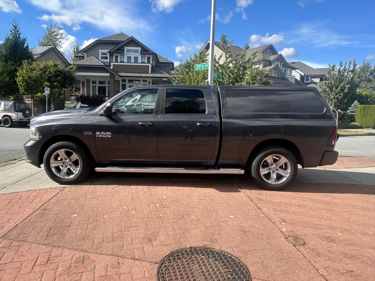 2014 RAM 1500 4WD CREW CAB 149" SPORT Photo
