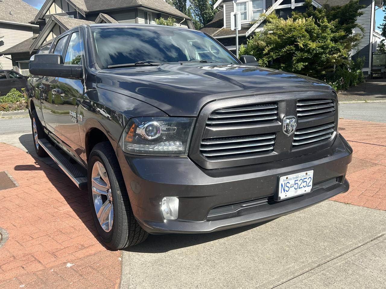 2014 RAM 1500 4WD CREW CAB 149" SPORT Photo