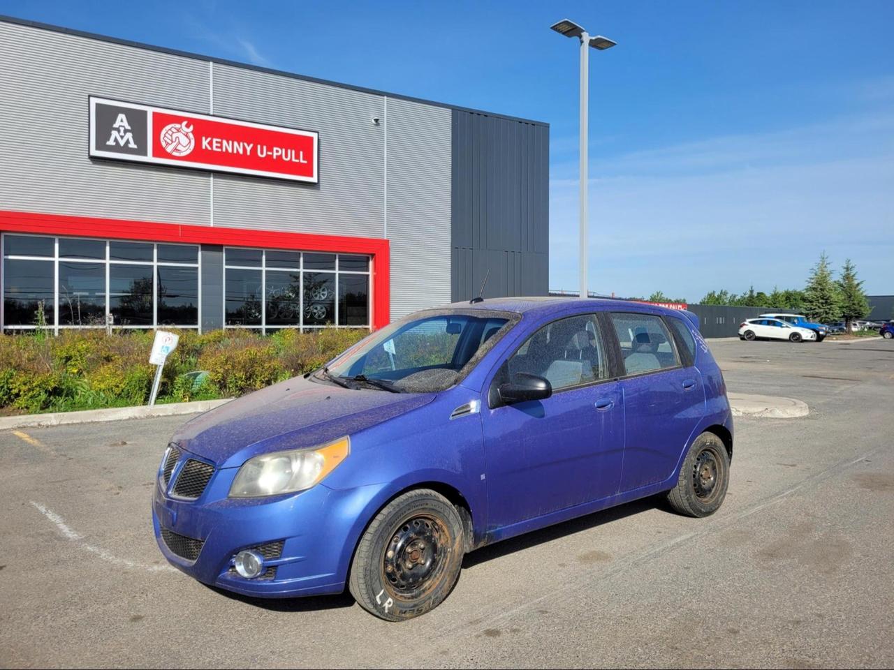 2009 Pontiac G3 Wave in Blue. The vehicle has 136,512km. The vehicle runs and drives. Check engine Tpms lights are on. Front driver side axle needs attention. Some imperfections/rust around the body. We dont perform any mechanical/safety inspections. The vehicle is sold as is and might need some work.
