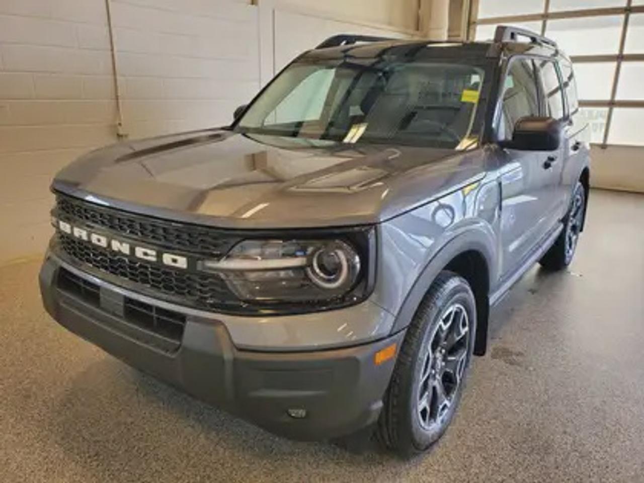 This all-new 2026 Ford Bronco Sport Outer Banks 300A shines in Carbonized Grey. This 5-passenger compact SUV is powered by the 1.5L EcoBoost® engine, delivering 181 horsepower and 190 lb-ft of torque. With an 8-speed automatic transmission and Auto Start-Stop Technology, it offers a smooth yet efficient drive, ideal for city commutes or highway adventures.

Key Features:
Premium-Trimmed Sport Heated Front Seats
Premium-Wrapped Heated Steering Wheel
Rear Parking Sensors
Memory Drivers Seat 
6-Way Power Passenger Seat
Push-Button Start
SYNC® 4 with a 13.2-inch Center Display, Wireless Apple CarPlay® and Android Auto
18 Machined-Face Ebony Black-Painted Aluminum Wheels
Dual-Zone Temperature Control
Terrain Management System Electronic Automatic  with 5 G.O.A.T. Modes (Normal, ECO, Sport, Slippery, Off-Road)
LED Headlights, Fog Lights, and Signature Lights
FordPass® Connect with Remote Start

Moose Jaw Ford, conveniently located at 1010 North Service Road in Moose Jaw, is your trusted destination for all your automotive needs. With an impressive 4.8-star Google rating from nearly 1,500 reviews, we are proud to deliver an exceptional vehicle-buying experience tailored just for you. Our Moose Jaw Motives set us apart, offering unbeatable value like half-priced oil changes for life on pre-owned vehicles, one year of key and remote protection, and one year of tire and rim protection. Enjoy peace of mind with every purchase. At Moose Jaw Ford, were committed to driving positive change in our community by combining exceptional service, high-quality vehicles, and a guest-first approach. Visit us today!
