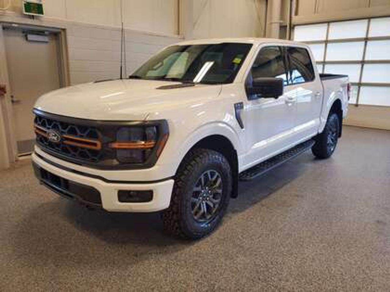 The all-new 2026 Ford F-150 Tremor 401A looks absolutely stunning in Oxford White. This pickup comes with the 3.5L EcoBoost® engine, delivering an impressive 400 horsepower and 500 lb-ft of torque. With EcoBoost® technology and a 10-speed automatic transmission, this truck achieves a highway/city fuel economy of 12.9L/100km (22 miles per gallon) combined highway/city. 

Key Features:
Selectable Drive Modes
18 Alloy W/ Dark Matte Finish Wheels
Heated Front Seats
Ford Co-Pilot 360 Assist 2.0
Adaptive Cruise Control
Lane Centering
Evasive Steering Assist
Front Parking Sensors
Pro Trailer Backup Assist
Pro Trailer Hitch Assist
BlueCruise
8 Speaker B&O Sound System
Hill Descent Control
Remote Start System
Engine Block Heater
Tow/Haul Package

Moose Jaw Ford, conveniently located at 1010 North Service Road in Moose Jaw, is your trusted destination for all your automotive needs. With an impressive 4.8-star Google rating from nearly 1,500 reviews, we are proud to deliver an exceptional vehicle-buying experience tailored just for you. Our Moose Jaw Motives set us apart, offering unbeatable value like half-priced oil changes for life on pre-owned vehicles, one year of key and remote protection, and one year of tire and rim protection. Enjoy peace of mind with every purchase. At Moose Jaw Ford, were committed to driving positive change in our community by combining exceptional service, high-quality vehicles, and a guest-first approach. Visit us today!