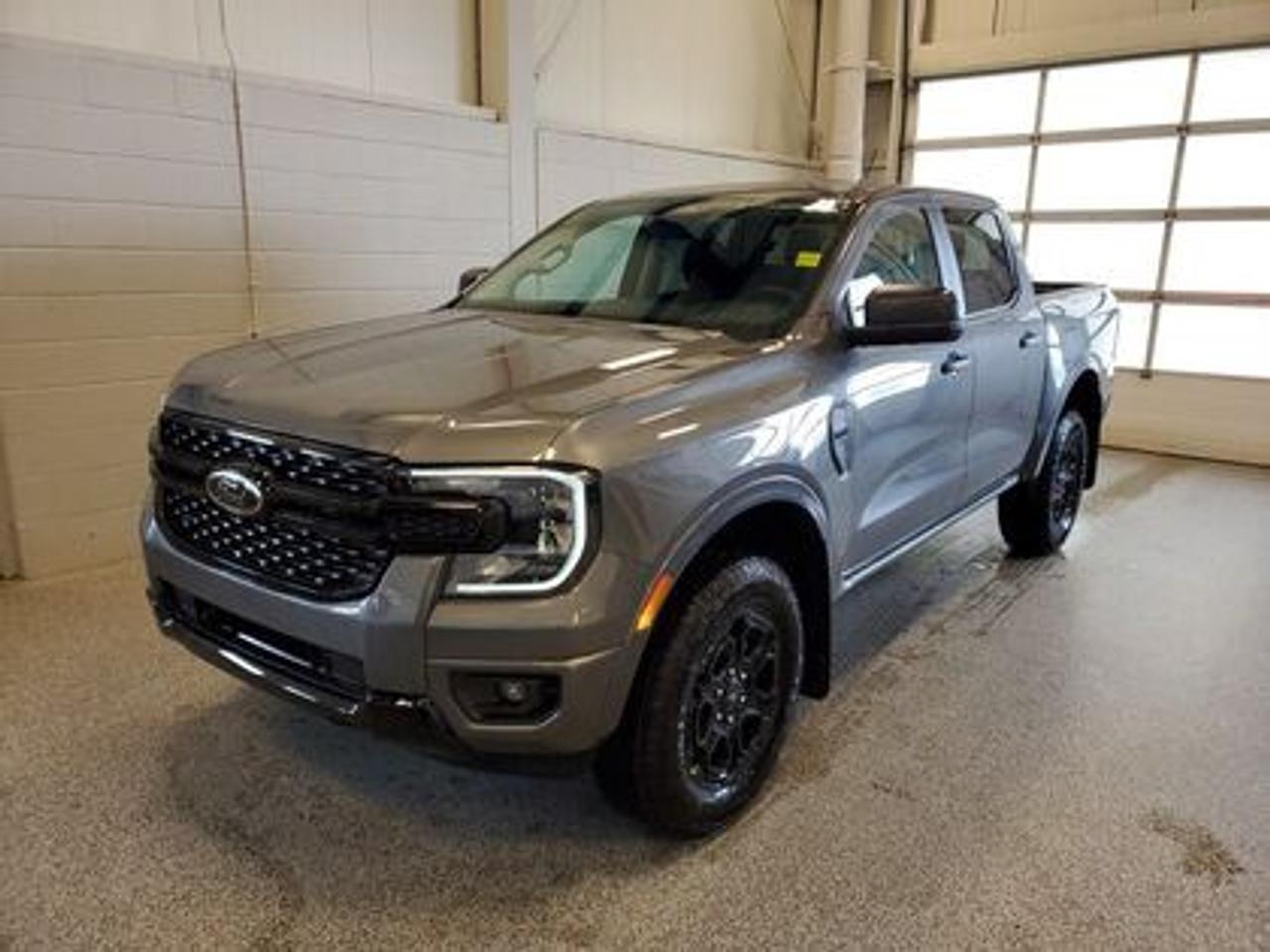 This all-new 2026 Ford Ranger XLT 301A looks absolutely stunning in Carbonized Grey Metallic. This versatile compact pickup comes equipped with the 2.3L EcoBoost® engine, producing 270 horsepower and 310 lb-ft of torque. By leveraging EcoBoost® technology and a 10-speed automatic transmission, this truck is designed to achieve 11.2L/100 km (25 miles per gallon) combined highway/city fuel economy.

Key Features:
12 Centre Display
Dual Zone Temperature Control 
Rear Window W/Privacy Glass & Defrost
Ford Co-Pilot360
Rear View Camera
Lane Keeping System 
Rear Parking Sensors
Reverse Break Assist 
10-Way Power Drivers Seat 
Heated Front Seats 
Cruise Control
FordPass Connect
Selectable Drive Modes
8 Cluster Display
Black Appearance Package
Engine Block Heater

Moose Jaw Ford, conveniently located at 1010 North Service Road in Moose Jaw, is your trusted destination for all your automotive needs. With an impressive 4.8-star Google rating from nearly 1,500 reviews, we are proud to deliver an exceptional vehicle-buying experience tailored just for you. Our Moose Jaw Motives set us apart, offering unbeatable value like half-priced oil changes for life on pre-owned vehicles, one year of key and remote protection, and one year of tire and rim protection. Enjoy peace of mind with every purchase. At Moose Jaw Ford, were committed to driving positive change in our community by combining exceptional service, high-quality vehicles, and a guest-first approach. Visit us today!